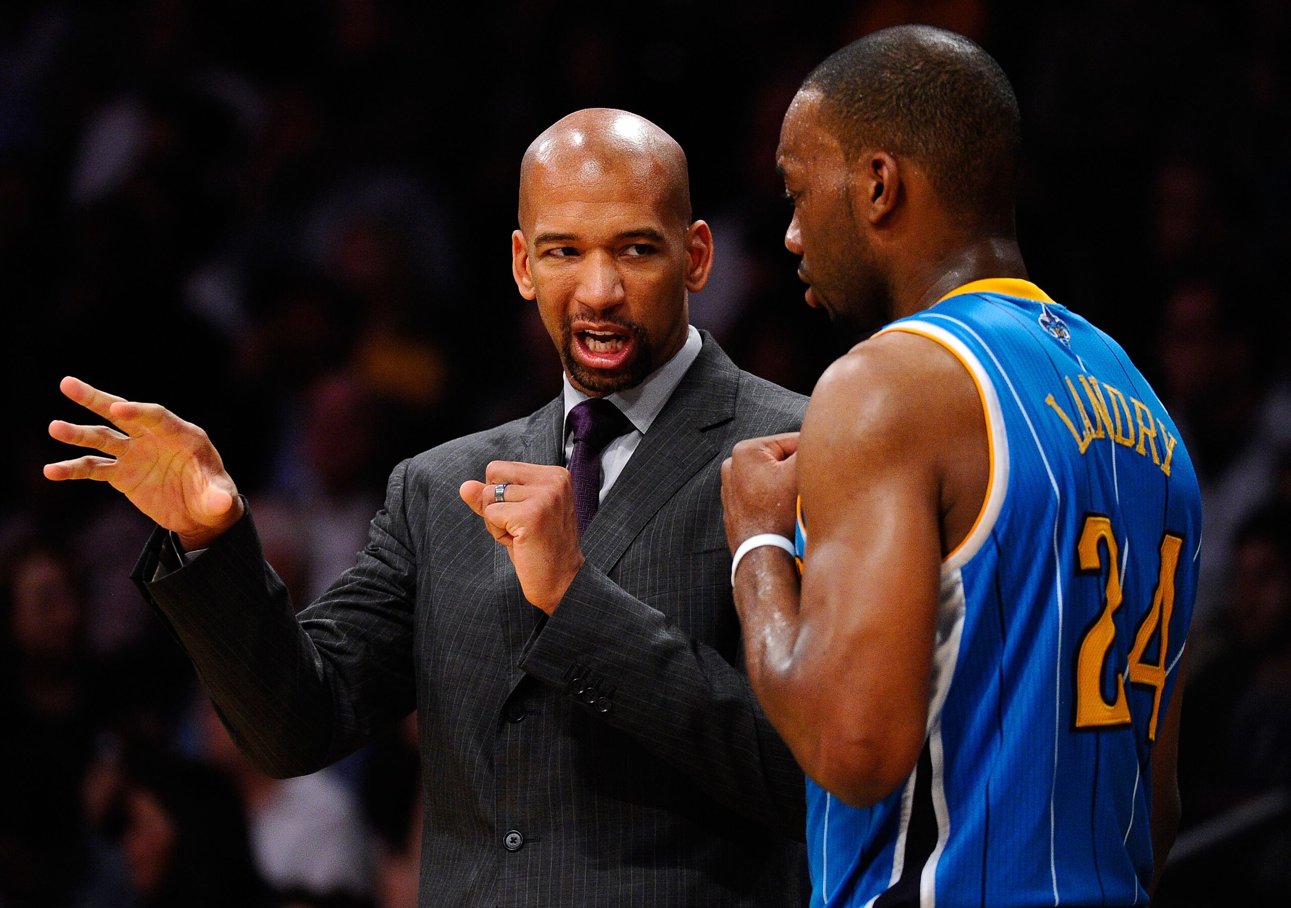 LOS ANGELES, CA - APRIL 20:  Head coach Monty Williams of the New Orleans Hornets talks with Carl Landry #24 while taking on the Los Angeles Lakers in Game Two of the Western Conference Quarterfinals in the 2011 NBA Playoffs on April 20, 2011 at Staples C