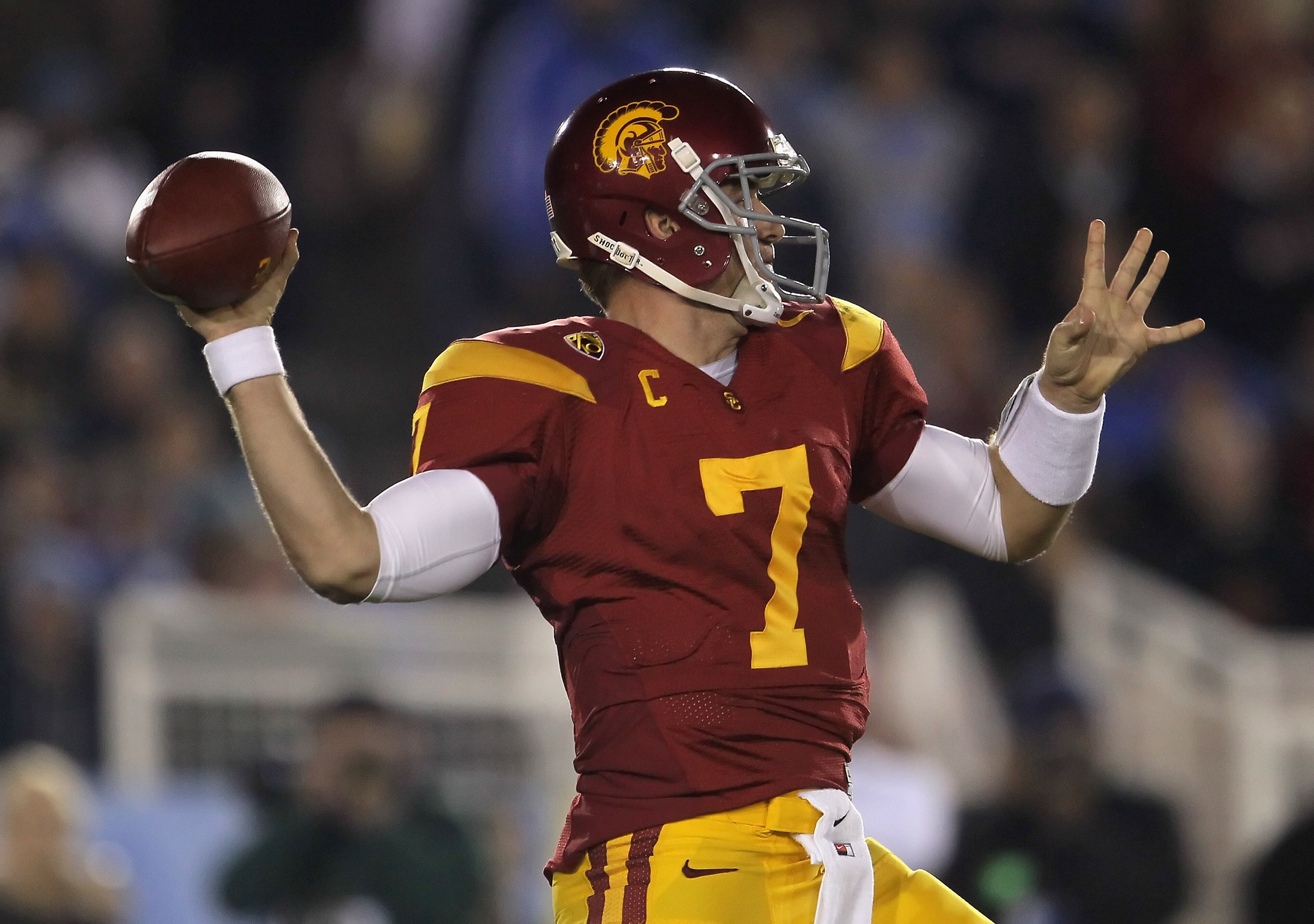 PASADENA, CA - DECEMBER 04:  Quarterback Matt Barkley #7 of the USC Trojans drops back to pass against the UCLA Bruins during the first half at the Rose Bowl on December 4, 2010 in Pasadena, California.  (Photo by Jeff Gross/Getty Images)