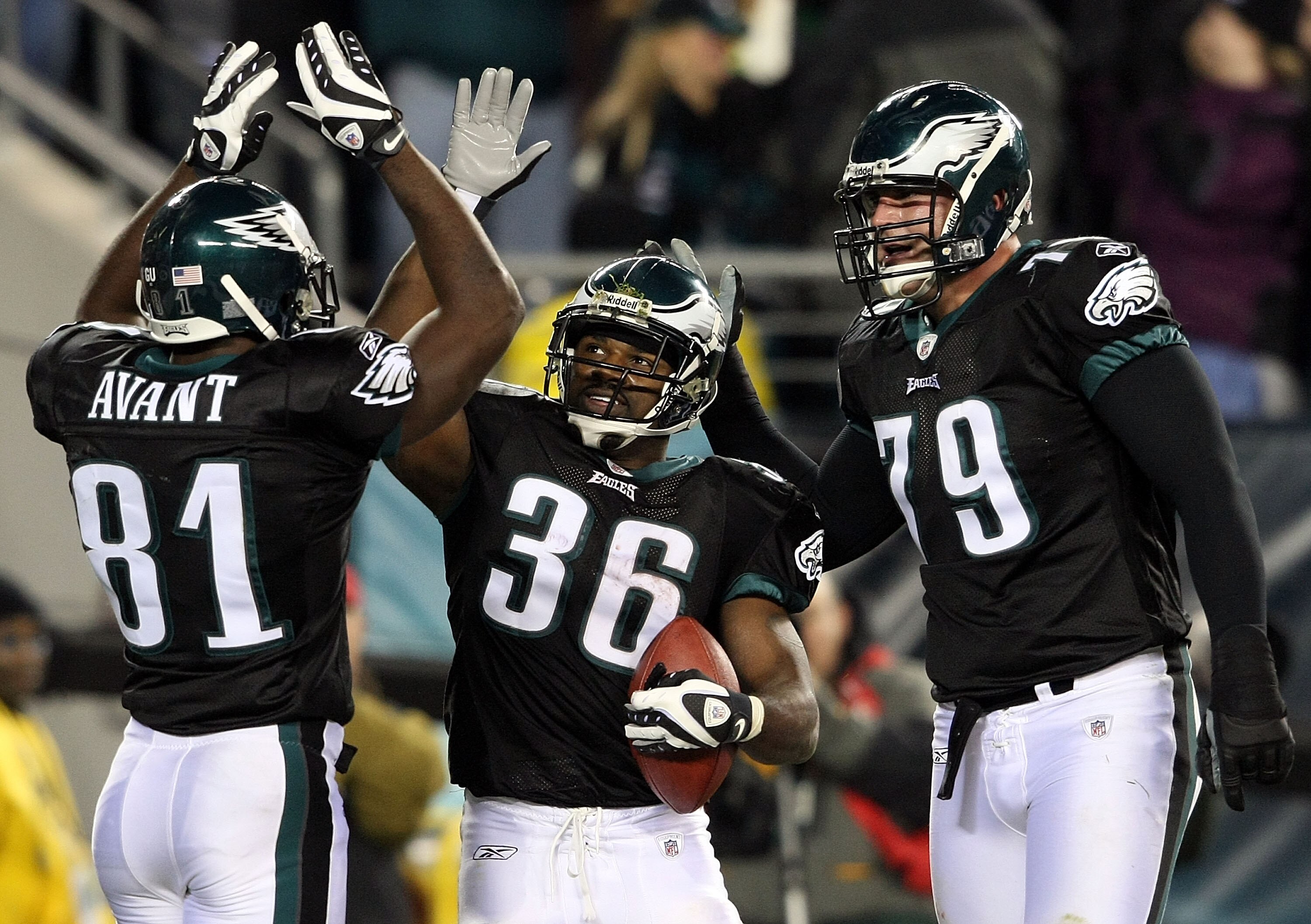 PHILADELPHIA - NOVEMBER 27:  (L-R) Jason Avant #81, Brian Westbrook #36 and Todd Herremans #79  of the Philadelphia Eagles celebrate Westbrook's third touchdown against the Arizona Cardinals at Lincoln Financial Field on November 27, 2008 in Philadelphia,