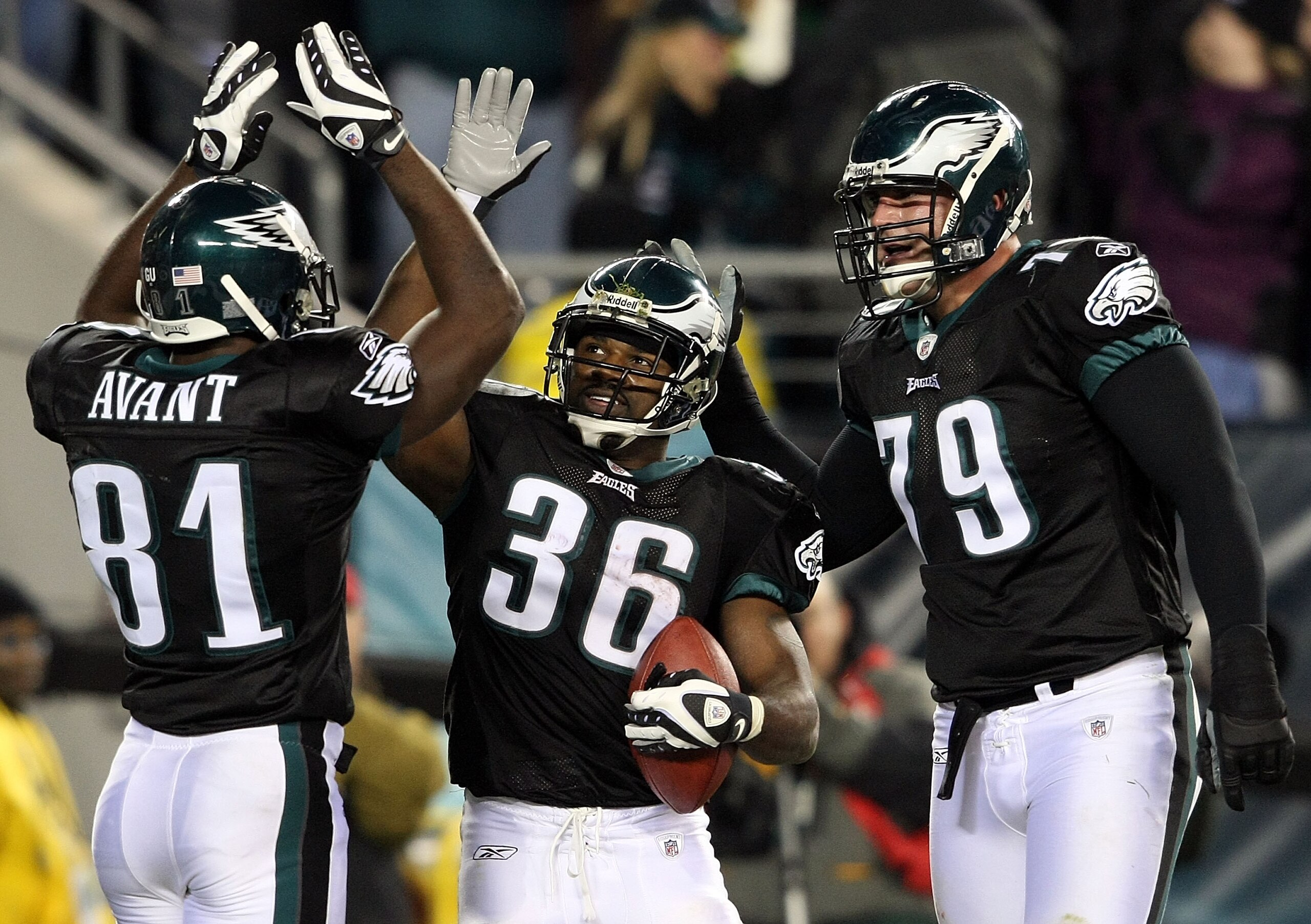 PHILADELPHIA - NOVEMBER 27:  (L-R) Jason Avant #81, Brian Westbrook #36 and Todd Herremans #79  of the Philadelphia Eagles celebrate Westbrook's third touchdown against the Arizona Cardinals at Lincoln Financial Field on November 27, 2008 in Philadelphia,