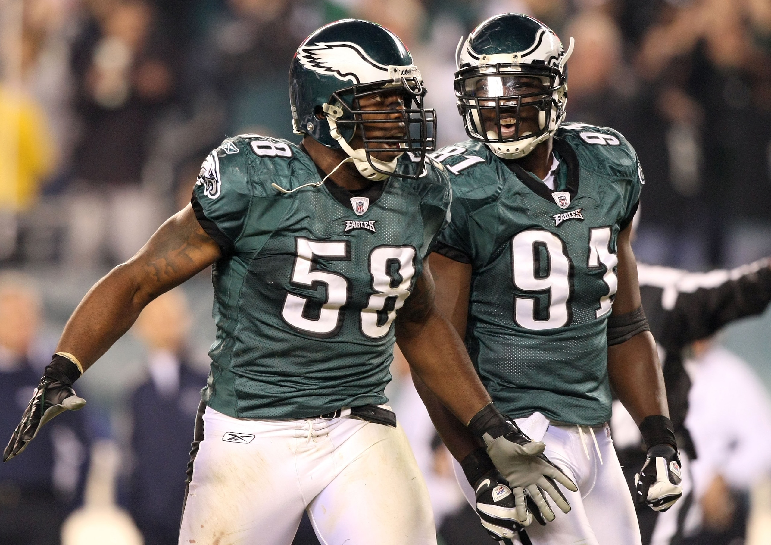 PHILADELPHIA - NOVEMBER 08:  Trent Cole #58 and Chris Clemons #91 of the Philadelphia Eagles celebrate after Cole sacked Tony Romo #9 of the Dallas Cowboys in the third quarter at Lincoln Financial Field on November 8, 2009 in Philadelphia, Pennsylvania.