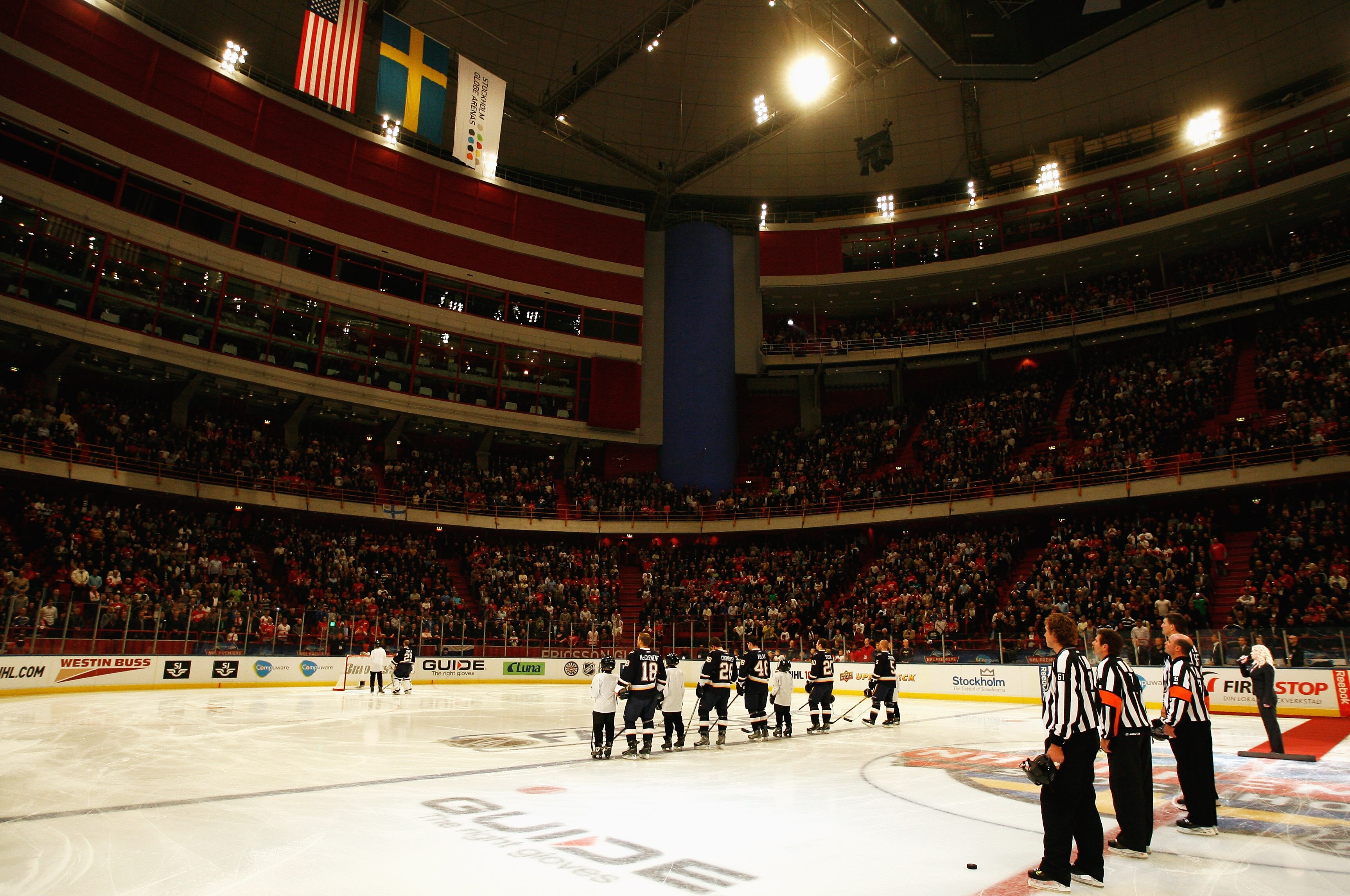 STOCKHOLM, SWEDEN - OCTOBER 03:  Players from both teams look on during the national anthems of Sweden and United States during the 2009 Compuware NHL Premiere Stockholm match between St. Louis Blues and Detroit Red Wings at the Ericsson Globe on October
