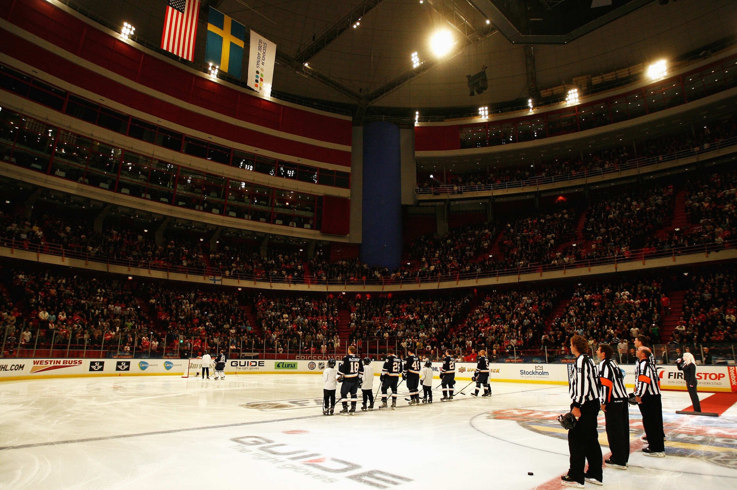 STOCKHOLM, SWEDEN - OCTOBER 03:  Players from both teams look on during the national anthems of Sweden and United States during the 2009 Compuware NHL Premiere Stockholm match between St. Louis Blues and Detroit Red Wings at the Ericsson Globe on October