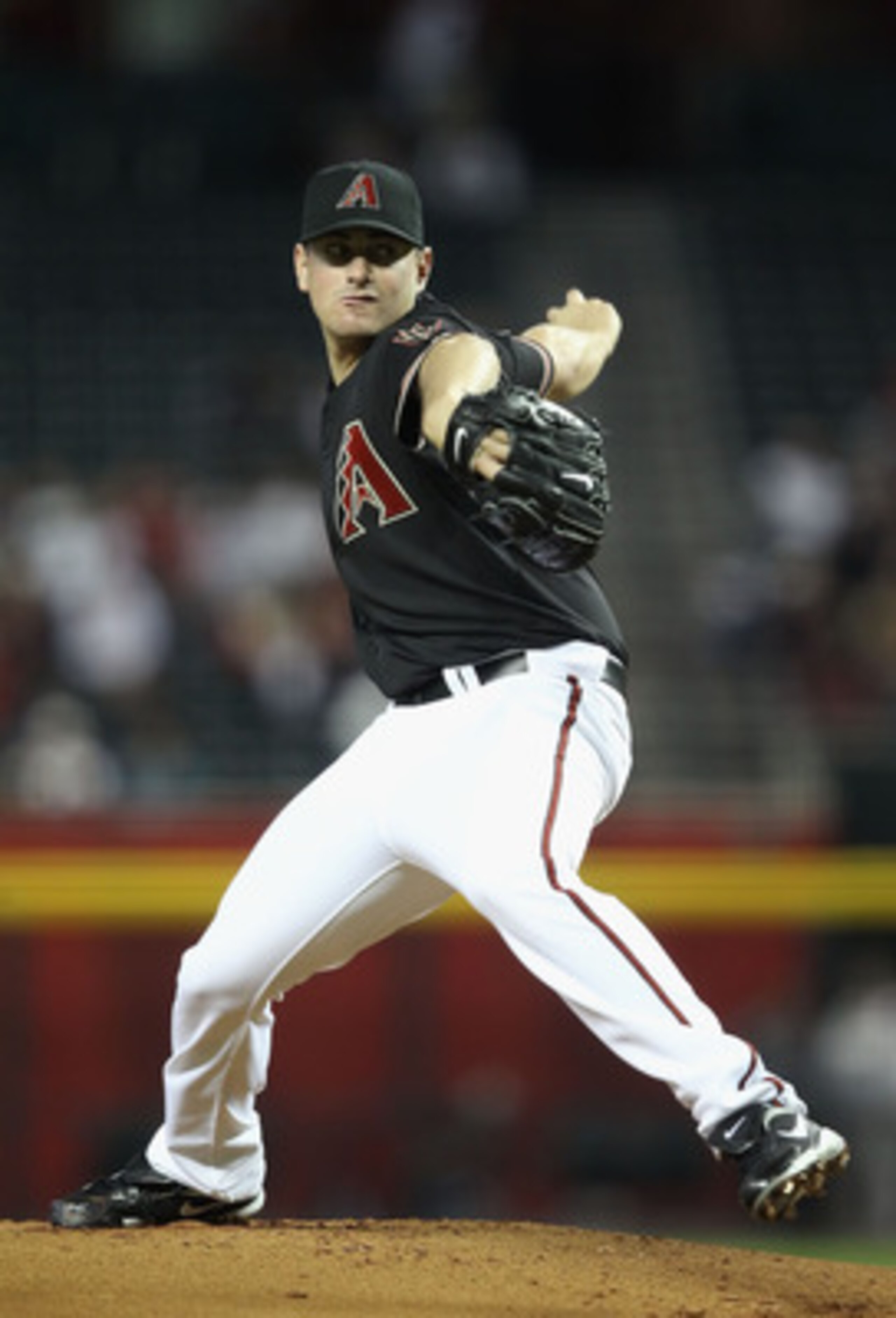 PHOENIX, AZ - APRIL 09:  Daniel Hudson #41 of the Arizona Diamondbacks pitches against the Cincinnati Reds during the Major League Baseball game at Chase Field on April 9, 2011 in Phoenix, Arizona. The Reds defeated the Diamondbacks 6-1.  (Photo by Christ