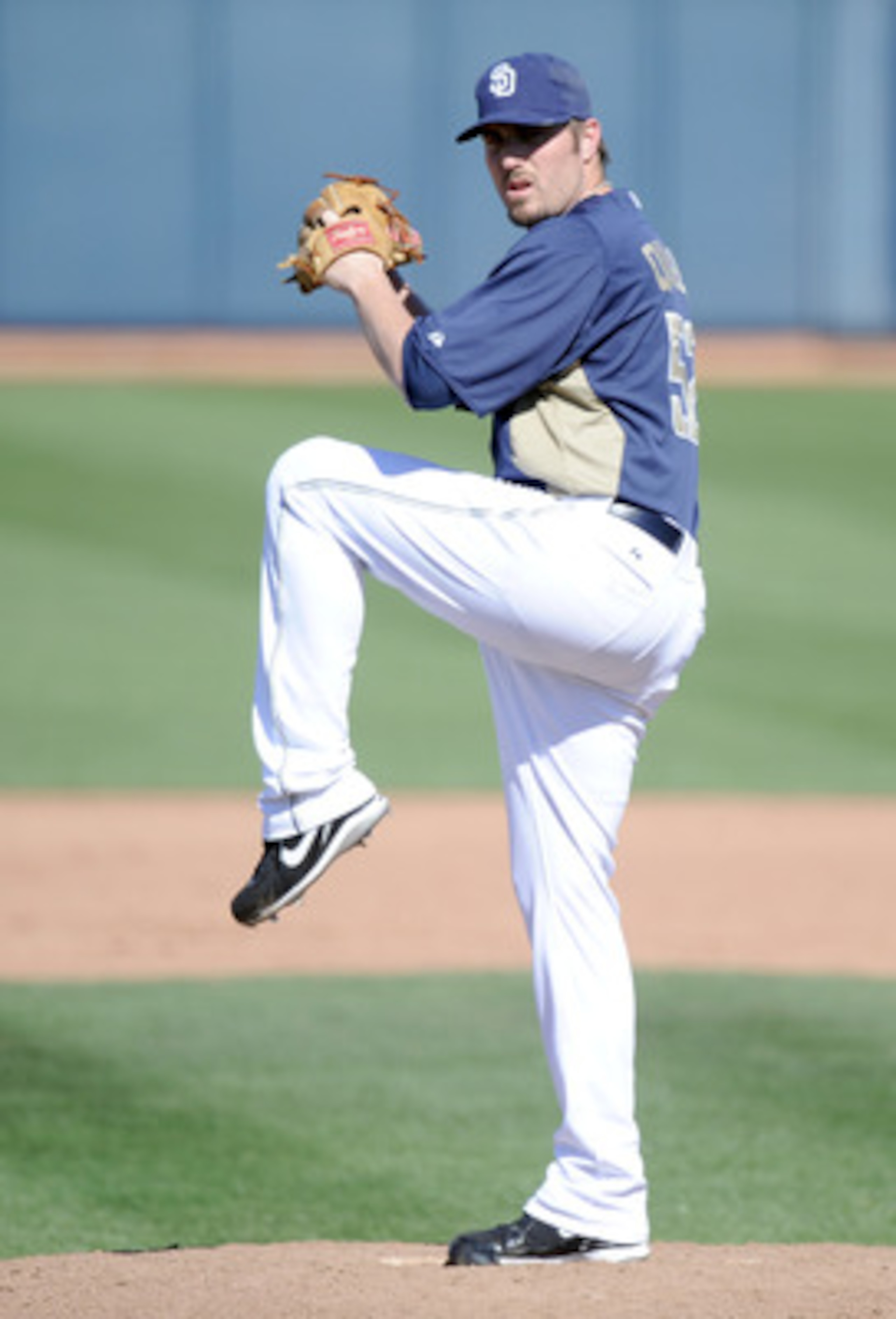 PEORIA, AZ - MARCH 02:  Chad Qualls #52 of the  San Diego Padres pitches against the Colorado Rockies during spring training at Peoria Stadium on March 2, 2011 in Peoria, Arizona.  (Photo by Harry How/Getty Images)
