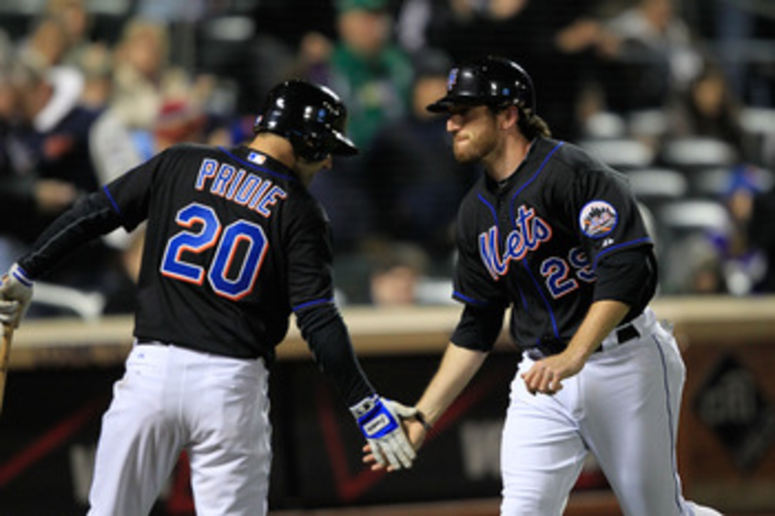 NEW YORK, NY - APRIL 22:  Ike Davis #29 of the New York Mets is congratulated for his two-run homer in the seventh inning by teammate Jason Pridie #20 against the Arizona Diamondbacks at Citi Field on April 22, 2011 in the Flushing neighborhood of the Que