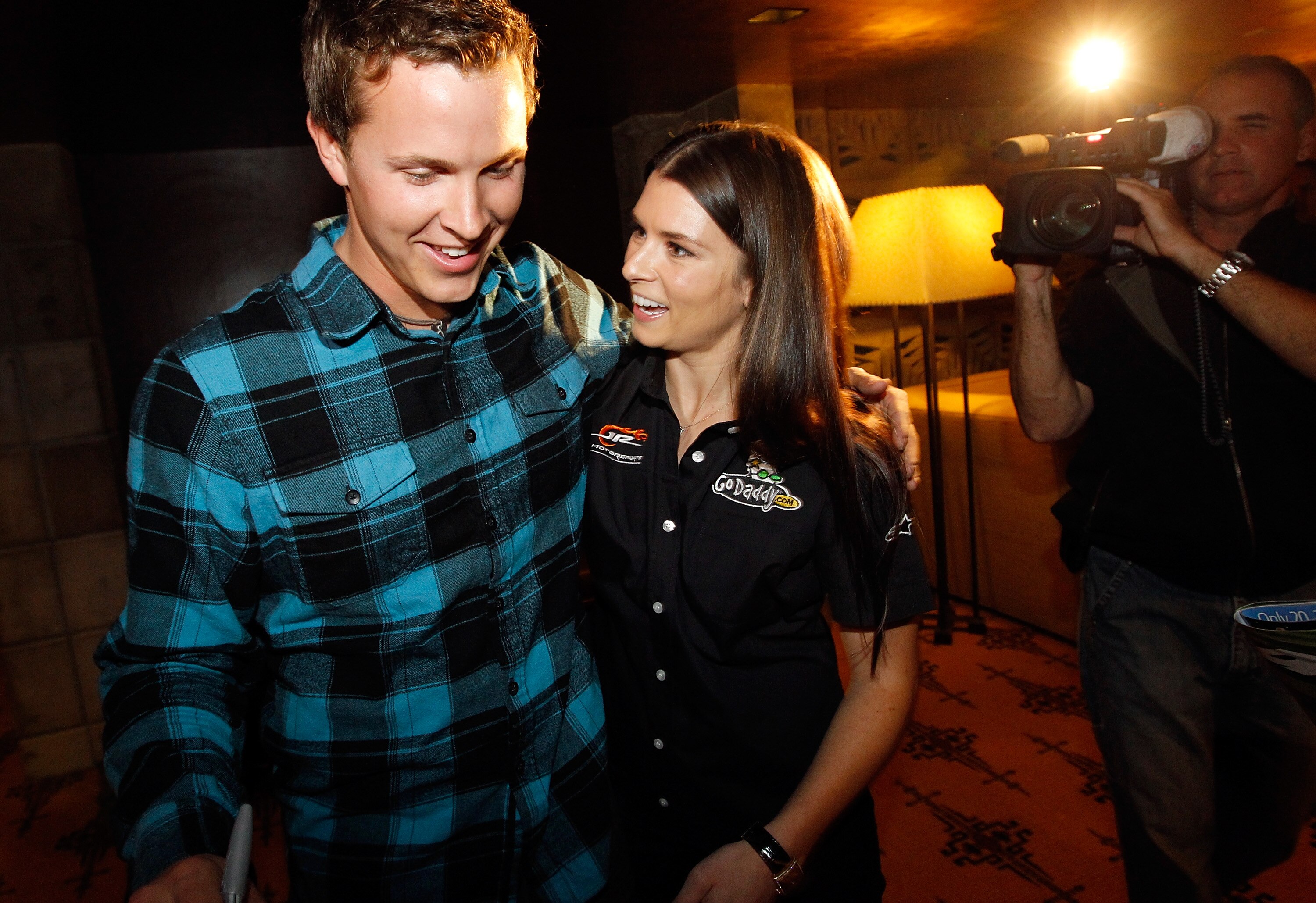 PHOENIX, AZ - FEBRUARY 24:  53rd Daytona 500 champion Trevor Bayne gis congratulated by NASCAR driver Danica Patrick February 24, 2011 in Phoenix, Arizona. Bayne and Patrick made a special appearance at Phoenix International Raceway's annual 'Night of Cha