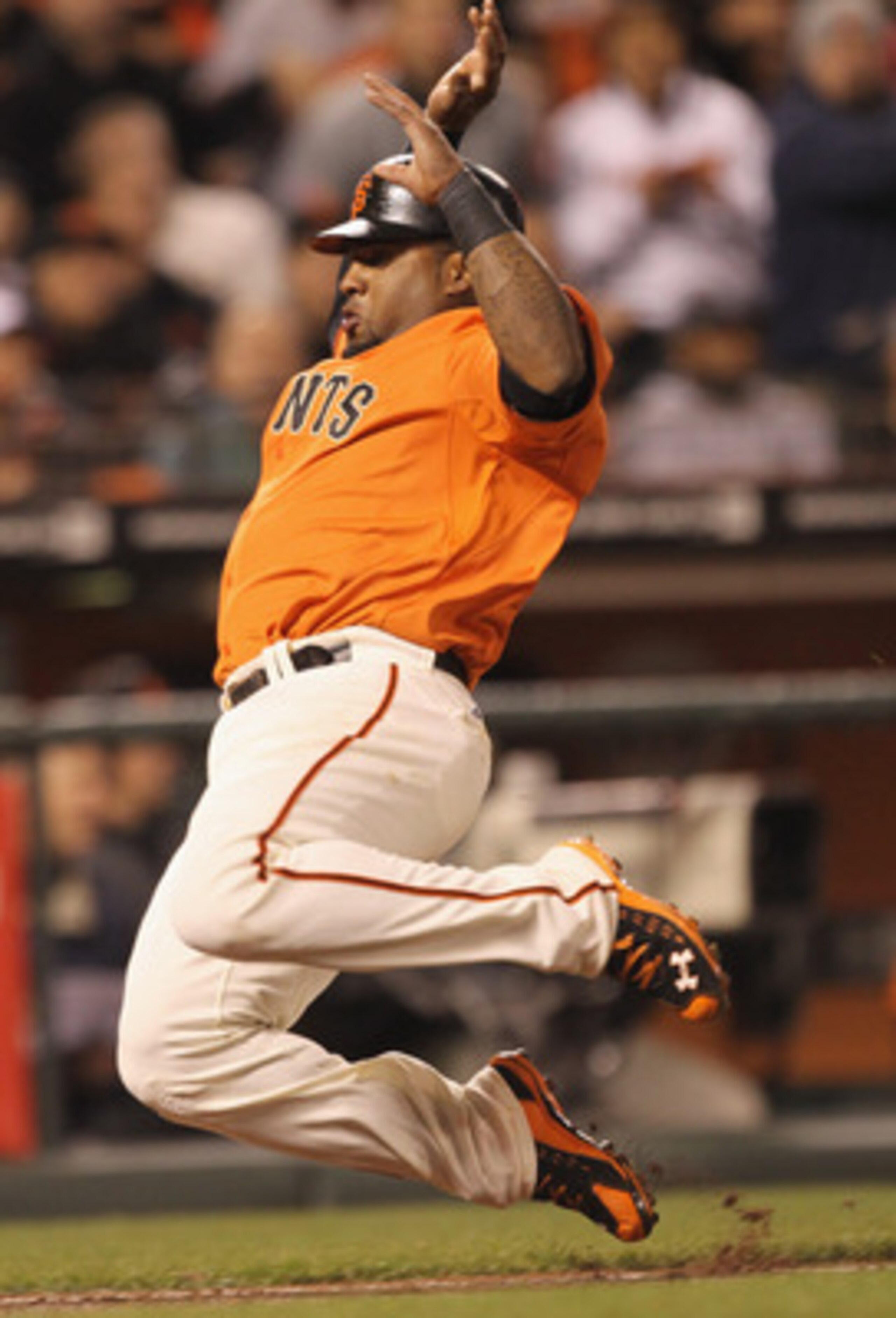 SAN FRANCISCO, CA - APRIL 22:  Pablo Sandoval #48 of the San Francisco Giants scores on a ground out by Pat Burrell #5 in the seventh inning of their game against the Atlanta Braves at AT&T Park on April 22, 2011 in San Francisco, California.  (Photo by E