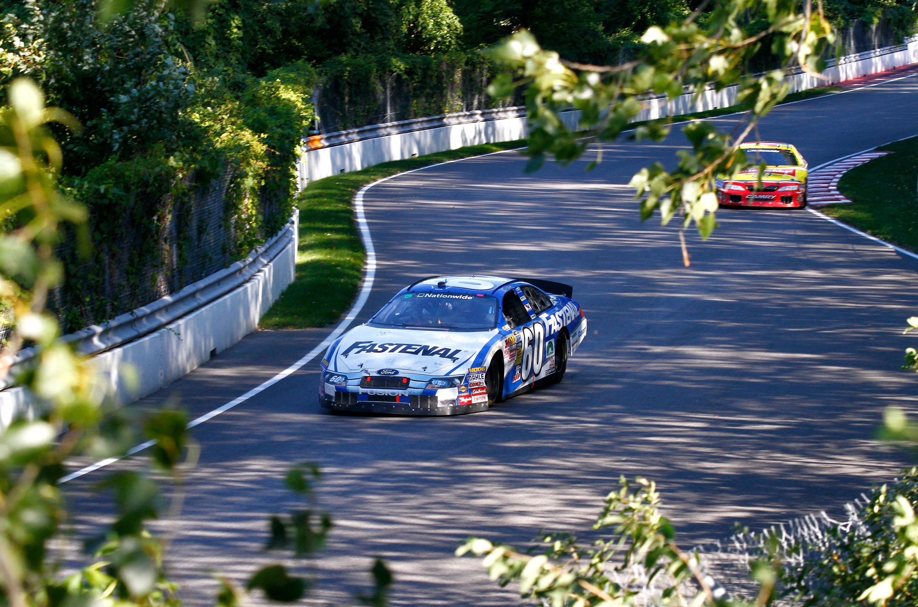 MONTREAL, QC - AUGUST 29:  Carl Edwards, driver of the #60 Fastenal Ford leads Marcos Ambrose, driver of the #47 Little Debbie Toyota during the NASCAR Nationwide Series Napa Auto Parts 200 on August 29, 2010 at the Circuit Gilles Villeneuve in Montreal,