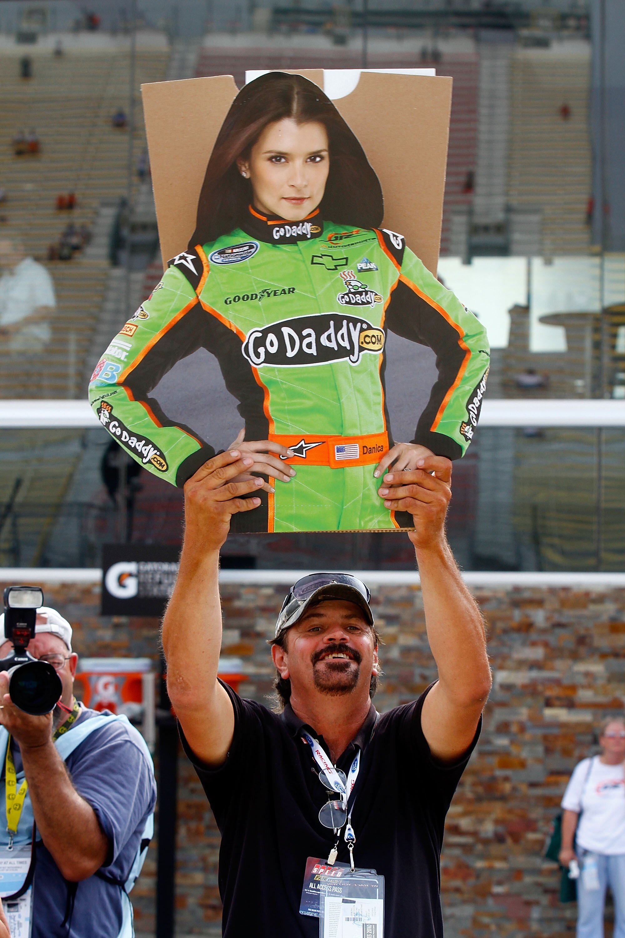 BROOKLYN, MI - AUGUST 14:  A fan holds up a likeness of Danica Patrick, driver of the #7 Hot Wheels / GoDaddy.com Chevrolet, during qualifying for the NASCAR Nationwide Series CARFAX 250 at Michigan International Speedway on August 14, 2010 in Brooklyn, M
