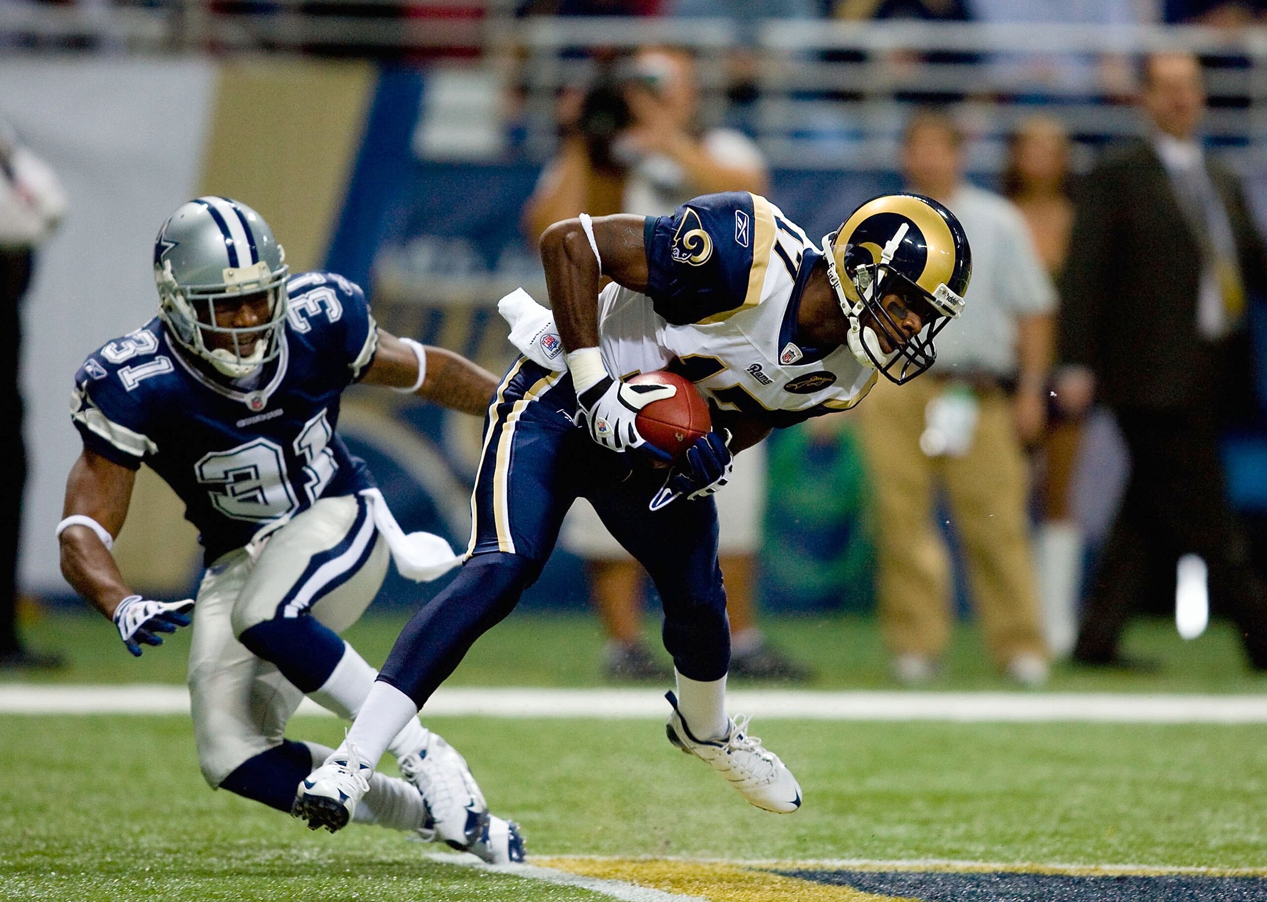 ST. LOUIS - OCTOBER 19: Donnie Avery #17 of the St. Louis Rams holds on to the ball while covered by Mike Jenkins #31 of the Dallas Cowboys during their NFL game at Edward Jones Dome on October 19, 2008 in St. Louis, Missouri. The Rams defeated the Cowb ST. LOUIS - OCTOBER 19: Donnie Avery #17 of the St. Louis Rams holds on to the ball while covered by Mike Jenkins #31 of the Dallas Cowboys during their NFL game at Edward Jones Dome on October 19, 2008 in St. Louis, Missouri. The Rams defeated the Cowb