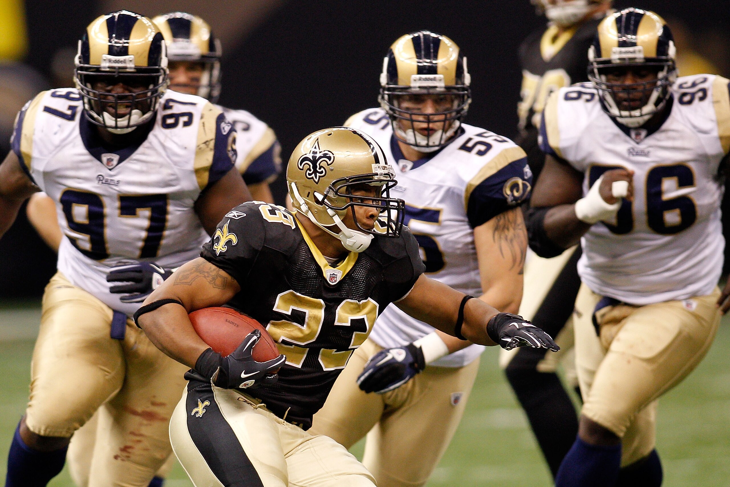 NEW ORLEANS, LA - DECEMBER 12: Pierre Thomas #23 of the New Orleans Saints runs past the defense of the St. Louis Rams at the Louisiana Superdome on December 12, 2010 in New Orleans, Louisiana. The Saints defeated the Rams 31-13. (Photo by Chris Graythe NEW ORLEANS, LA - DECEMBER 12: Pierre Thomas #23 of the New Orleans Saints runs past the defense of the St. Louis Rams at the Louisiana Superdome on December 12, 2010 in New Orleans, Louisiana. The Saints defeated the Rams 31-13. (Photo by Chris Graythe