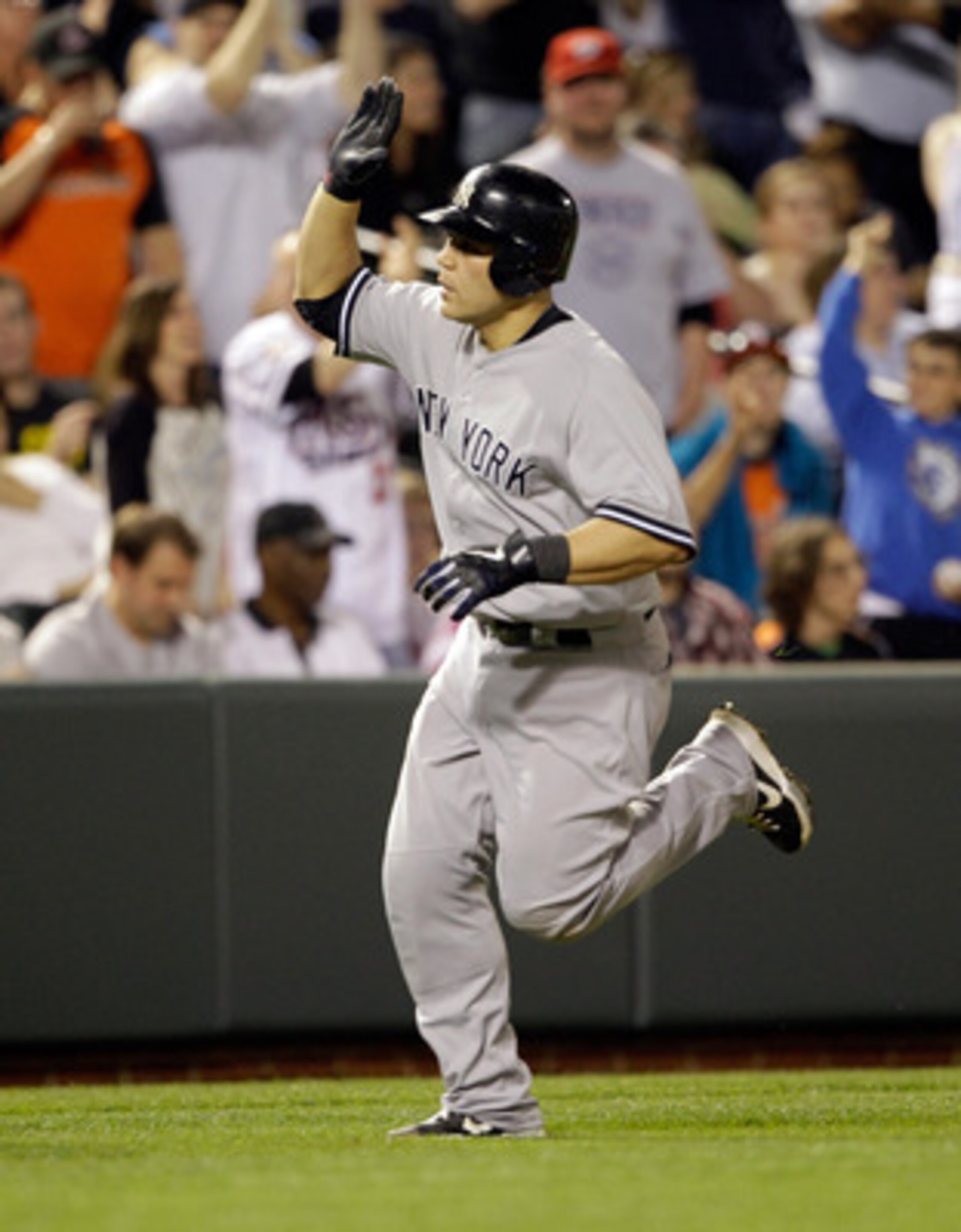 BALTIMORE, MD - APRIL 23:  Russell Martin #55 of the New York Yankees after hitting a solo homerun during the eighth inning against the Baltimore Orioles at Oriole Park at Camden Yards on April 23, 2011 in Baltimore, Maryland.  (Photo by Rob Carr/Getty Im