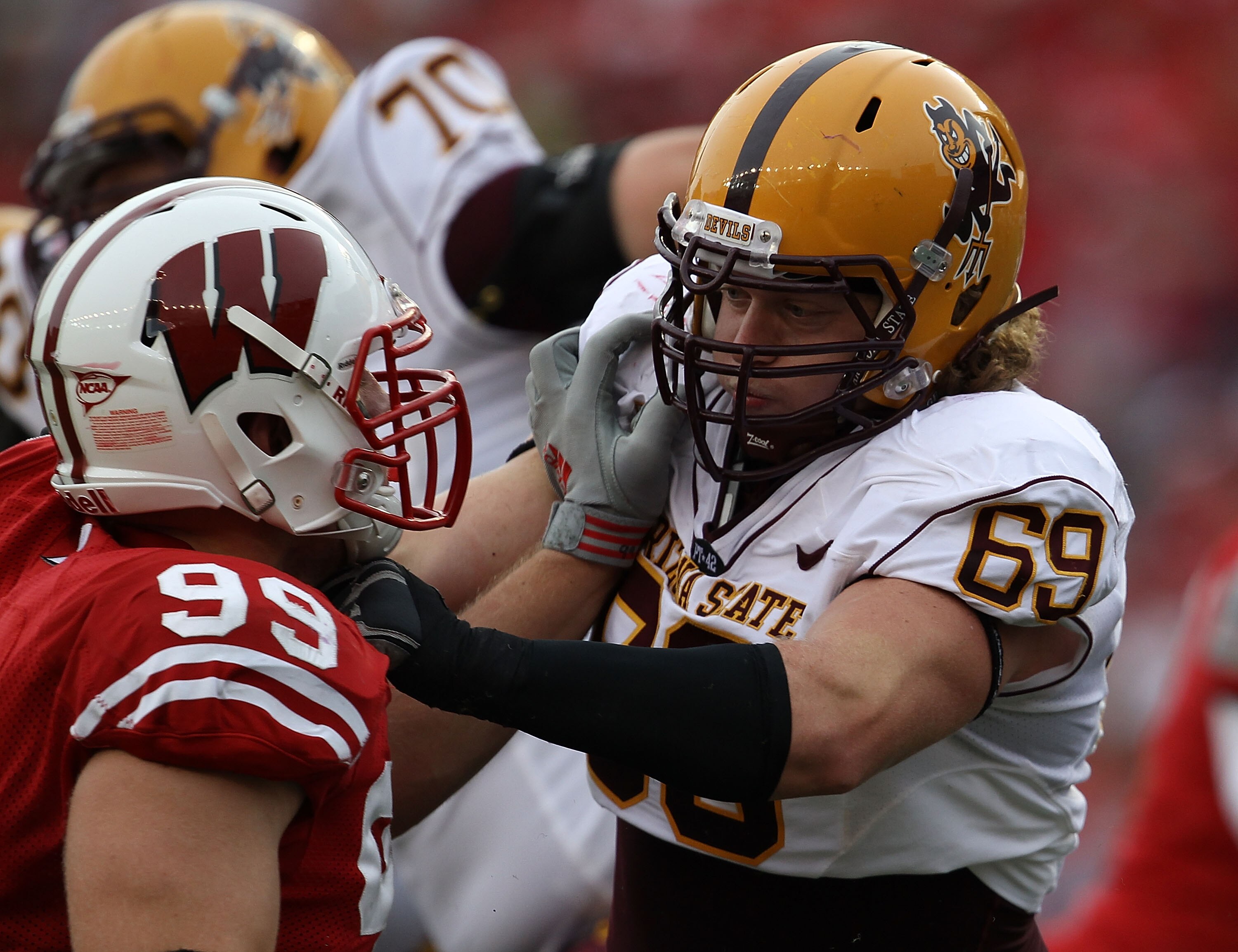 MADISON, WI - SEPTEMBER 18: Dan Knapp #69 of the Arizona State Sun Devils blocks against J.J. Watt #99 of the Wisconsin Badgers at Camp Randall Stadium on September 18, 2010 in Madison, Wisconsin. Wisconsin defeated Arizona State 20-19. (Photo by Jonathan