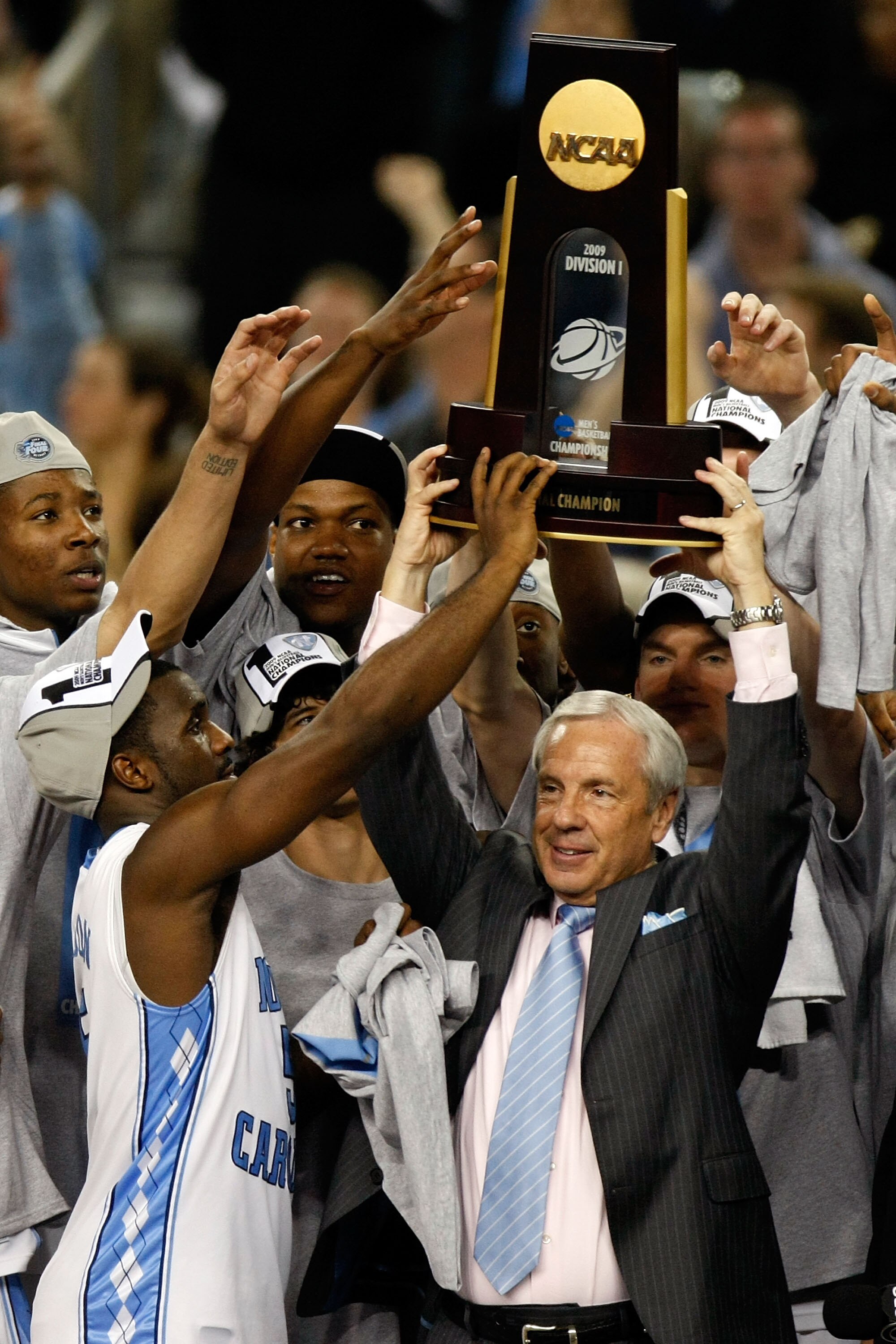 DETROIT - APRIL 06:  Head coach Roy Williams of the North Carolina Tar Heels celebrates with the championship trophy after defeating the Michigan State Spartans 89-72 during the 2009 NCAA Division I Men's Basketball National Championship game at Ford Fiel