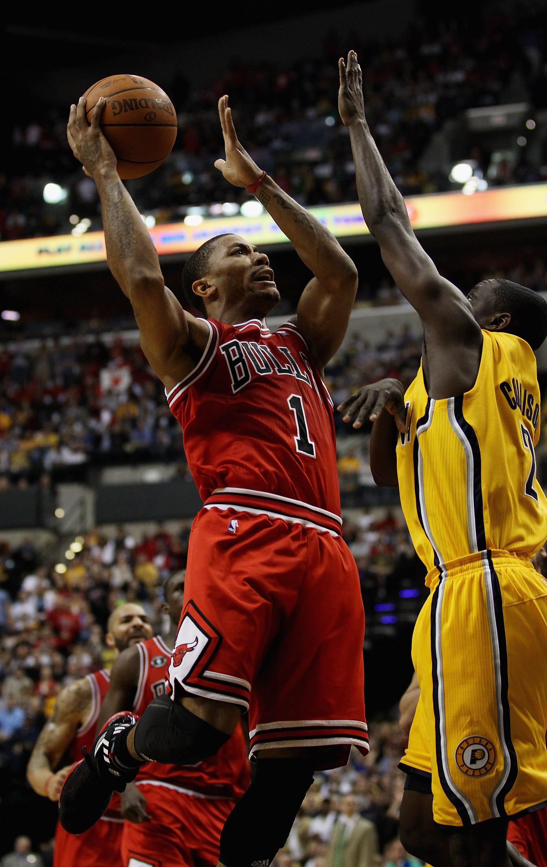 INDIANAPOLIS, IN - APRIL 23: Derrick Rose #1 of the Chicago Bulls puts up a shot against Darren Collison #2 of the Indiana Pacers in Game Four of the Eastern Conference Quarterfinals in the 2011 NBA Playoffs at Conseco Fieldhouse on April 23, 2011 in Indi