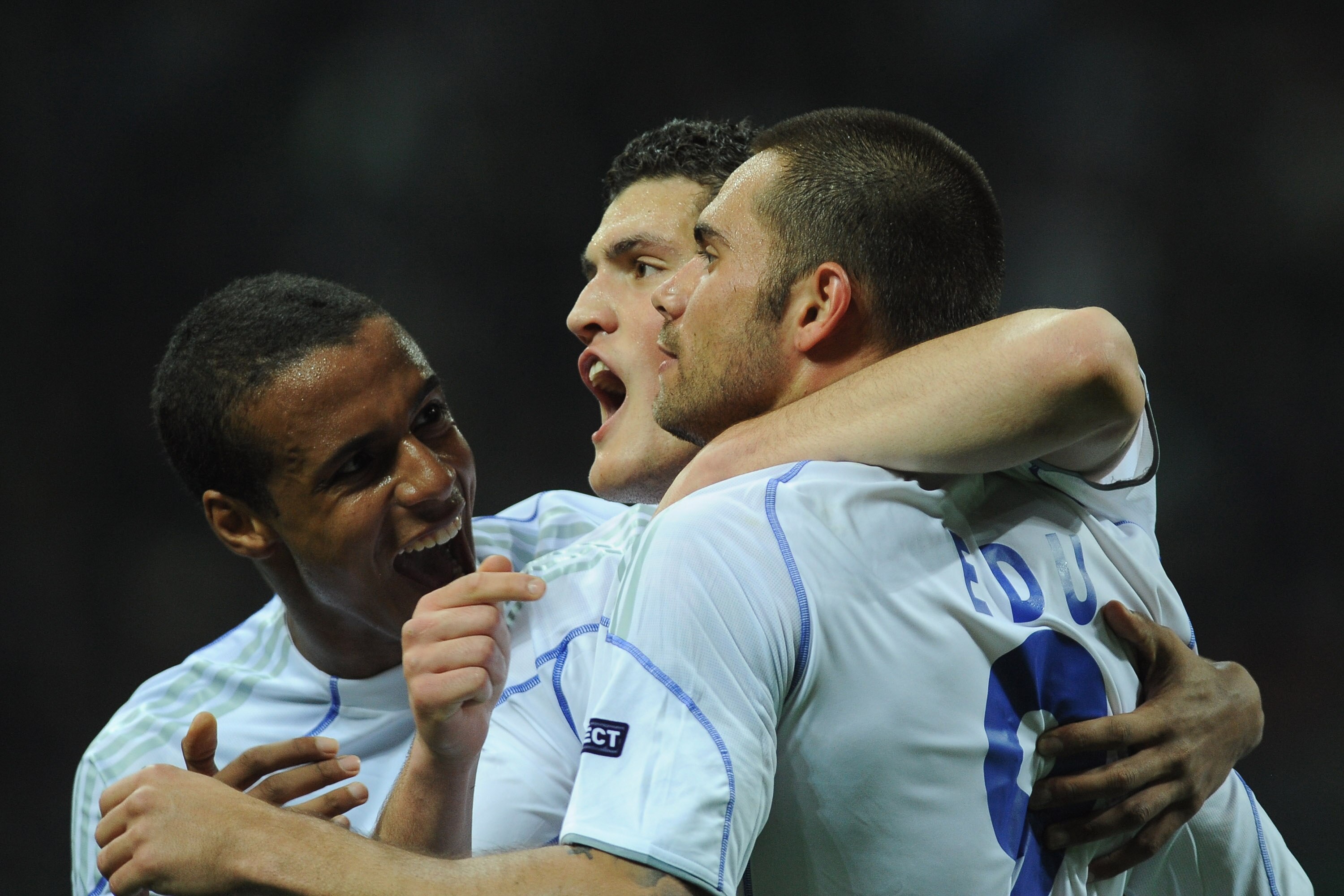 MILAN, ITALY - APRIL 05:  Edu (R) of Schalke 04 celebrates with his team mates after scoring a goal during the UEFA Champions League Quarter Final match between FC Internazionale Milano and Schalke 04 at San Siro Stadium on April 5, 2011 in Milan, Italy.