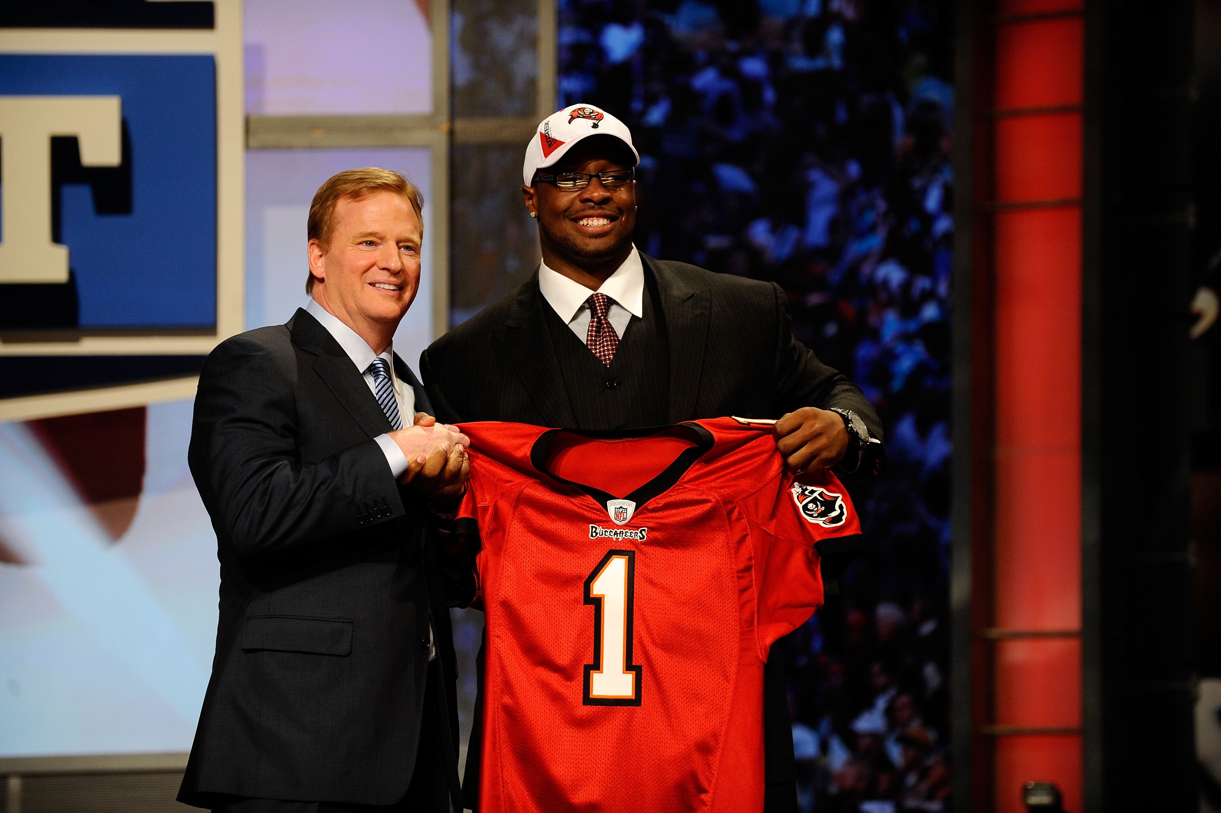 NEW YORK - APRIL 22:  Gerald McCoy (R) from the Oklahoma Sooners poses with NFL Commissioner Roger Goodell as they hold a Tampa Bay Buccaneers jersey after McCoy was selected by the Buccaneers number 3 overall during the first round of the 2010 NFL Draft
