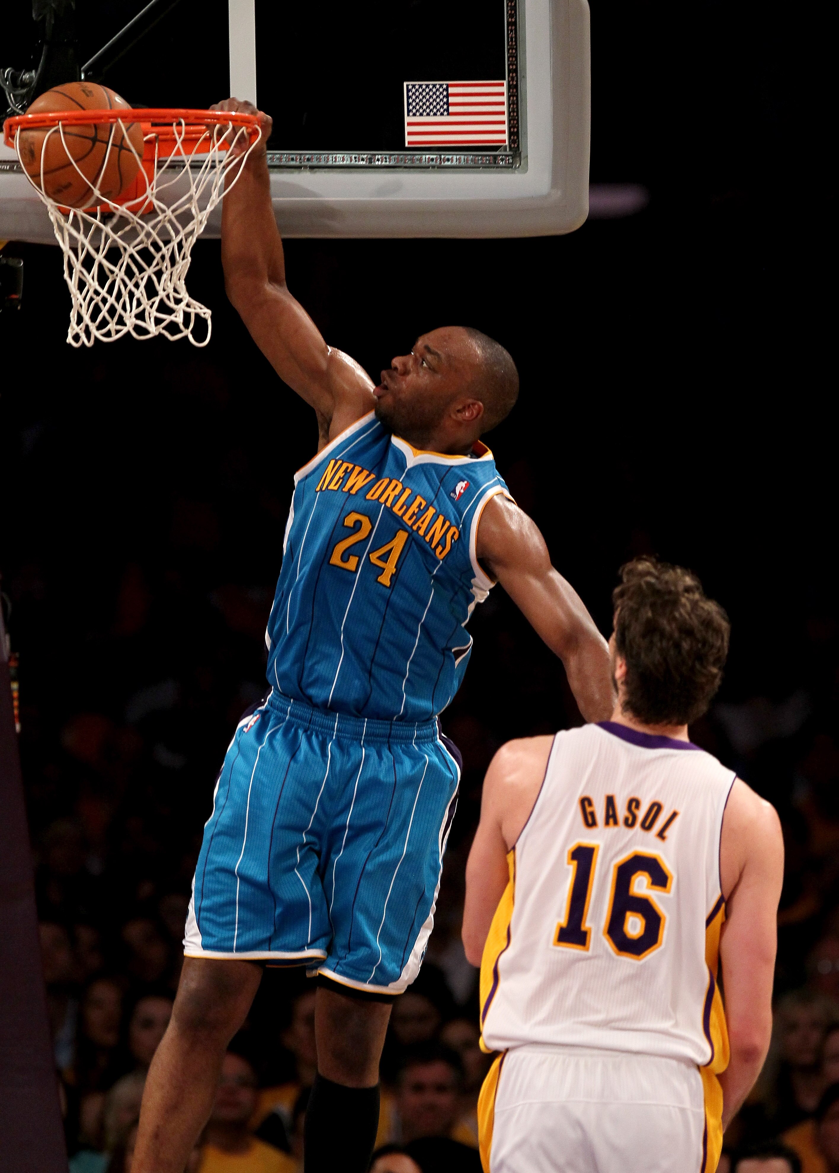 LOS ANGELES, CA - APRIL 17:  Carl Landry #24 of  the New Orleans Hornets dunks over Pau Gasol #16 of the Los Angeles Lakers in Game One of the Western Conference Quarterfinals in the 2011 NBA Playoffs on April 17, 2011 at Staples Center in Los Angeles, Ca