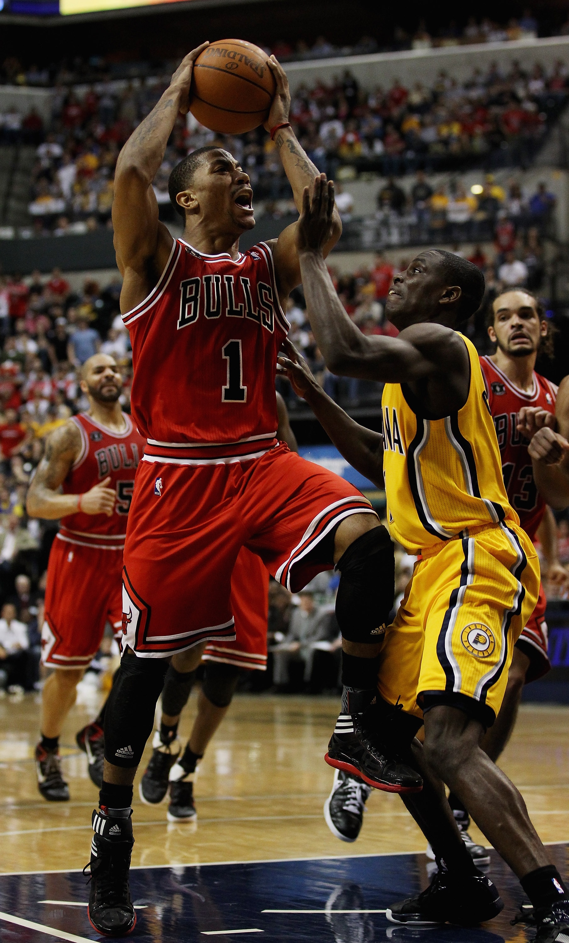 INDIANAPOLIS, IN - APRIL 23: Derrick Rose #1 of the Chicago Bulls puts up a shot against Darren Collison #2 of the Indiana Pacers in Game Four of the Eastern Conference Quarterfinals in the 2011 NBA Playoffs at Conseco Fieldhouse on April 23, 2011 in Indi