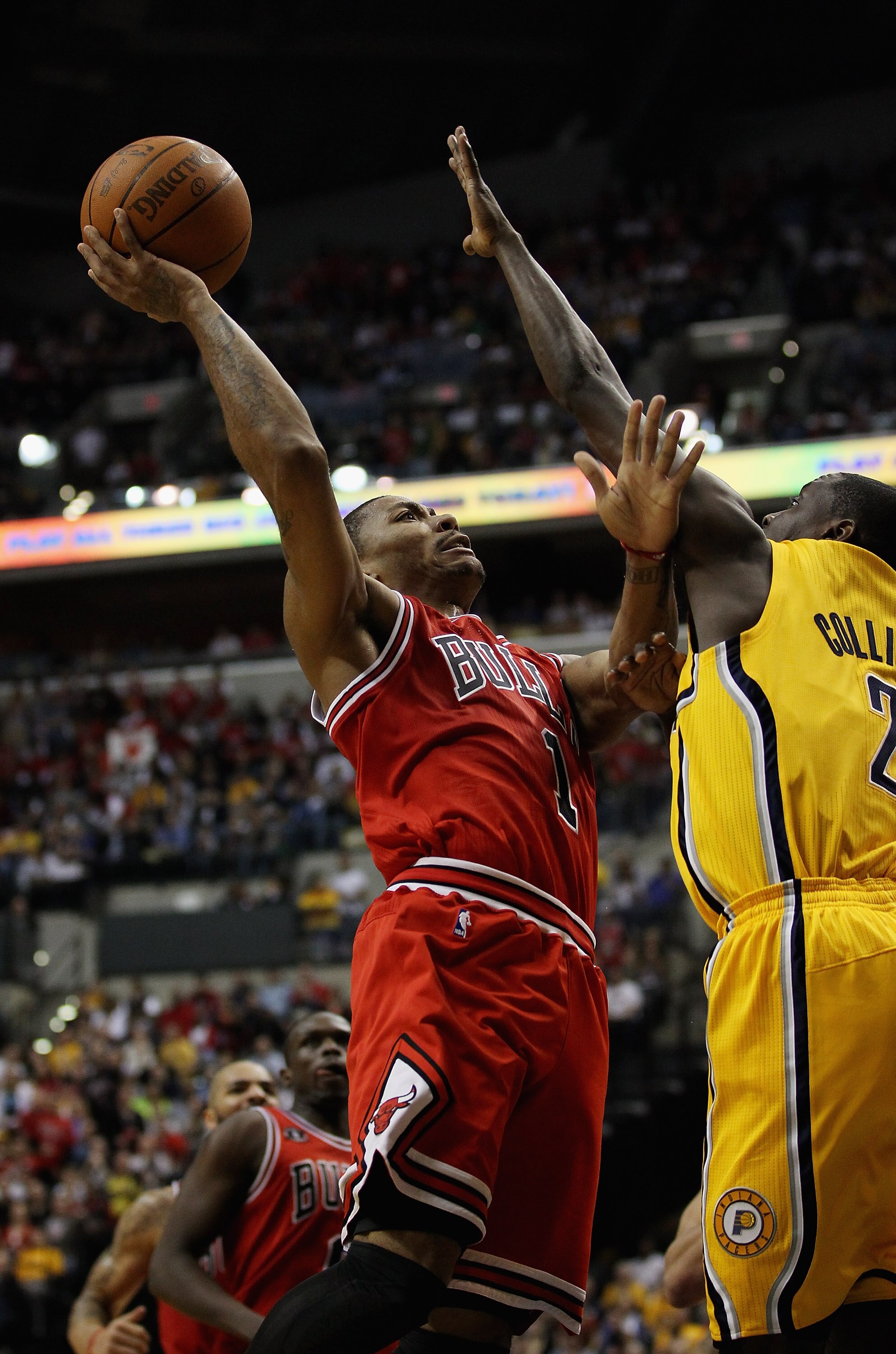 INDIANAPOLIS, IN - APRIL 23: Derrick Rose #1 of the Chicago Bulls puts up a shot against Darren Collison #2 of the Indiana Pacers in Game Four of the Eastern Conference Quarterfinals in the 2011 NBA Playoffs at Conseco Fieldhouse on April 23, 2011 in Indi