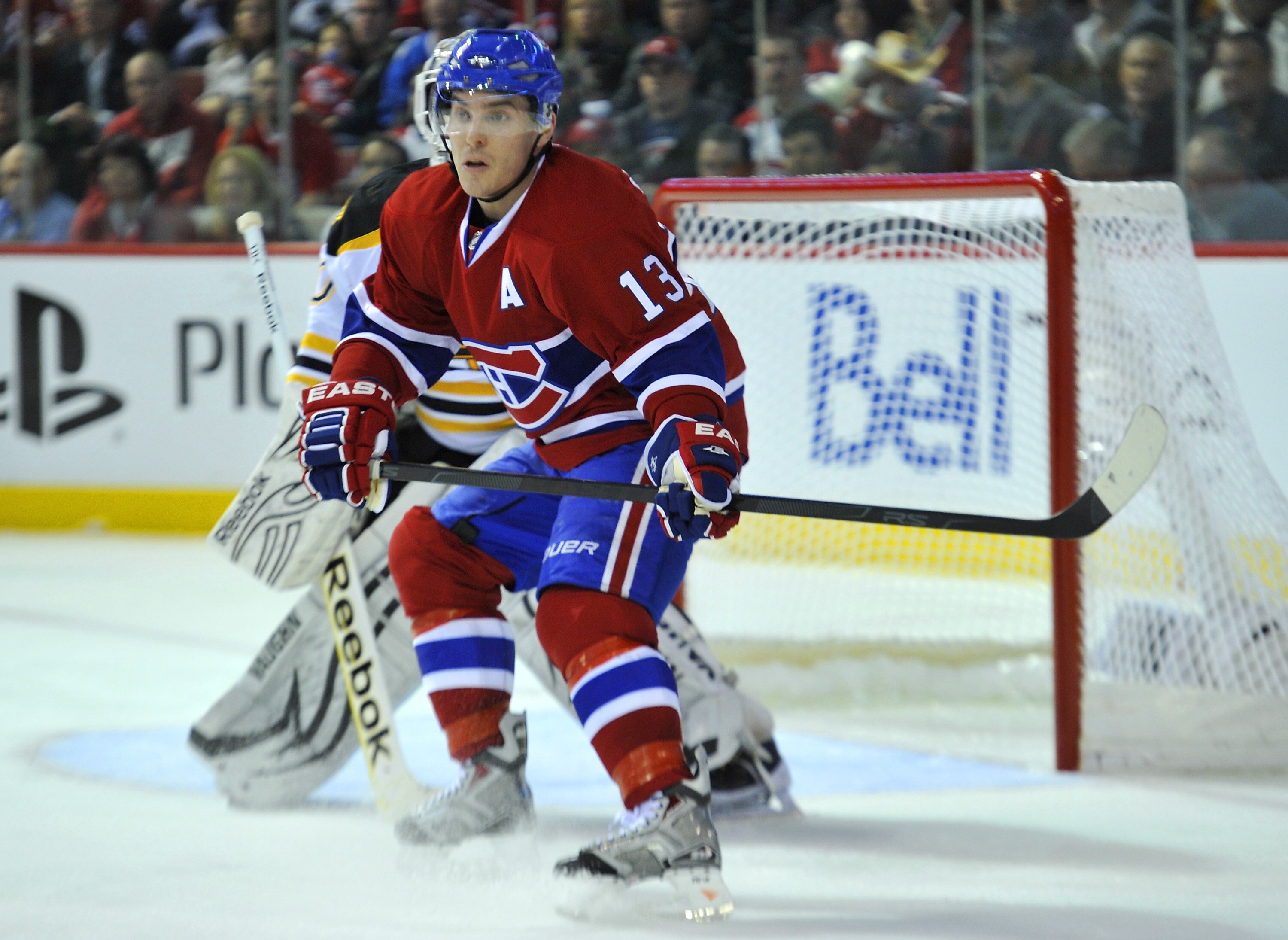 MONTREAL, QC - APRIL 18:  Michael Cammalleri #13 of the Montreal Canadiens skates to the front of the net out front of Tim Thomas #30 of the Boston Bruins in Game Three of the Eastern Conference Quarterfinals during the 2011 NHL Stanley Cup Playoffs at th