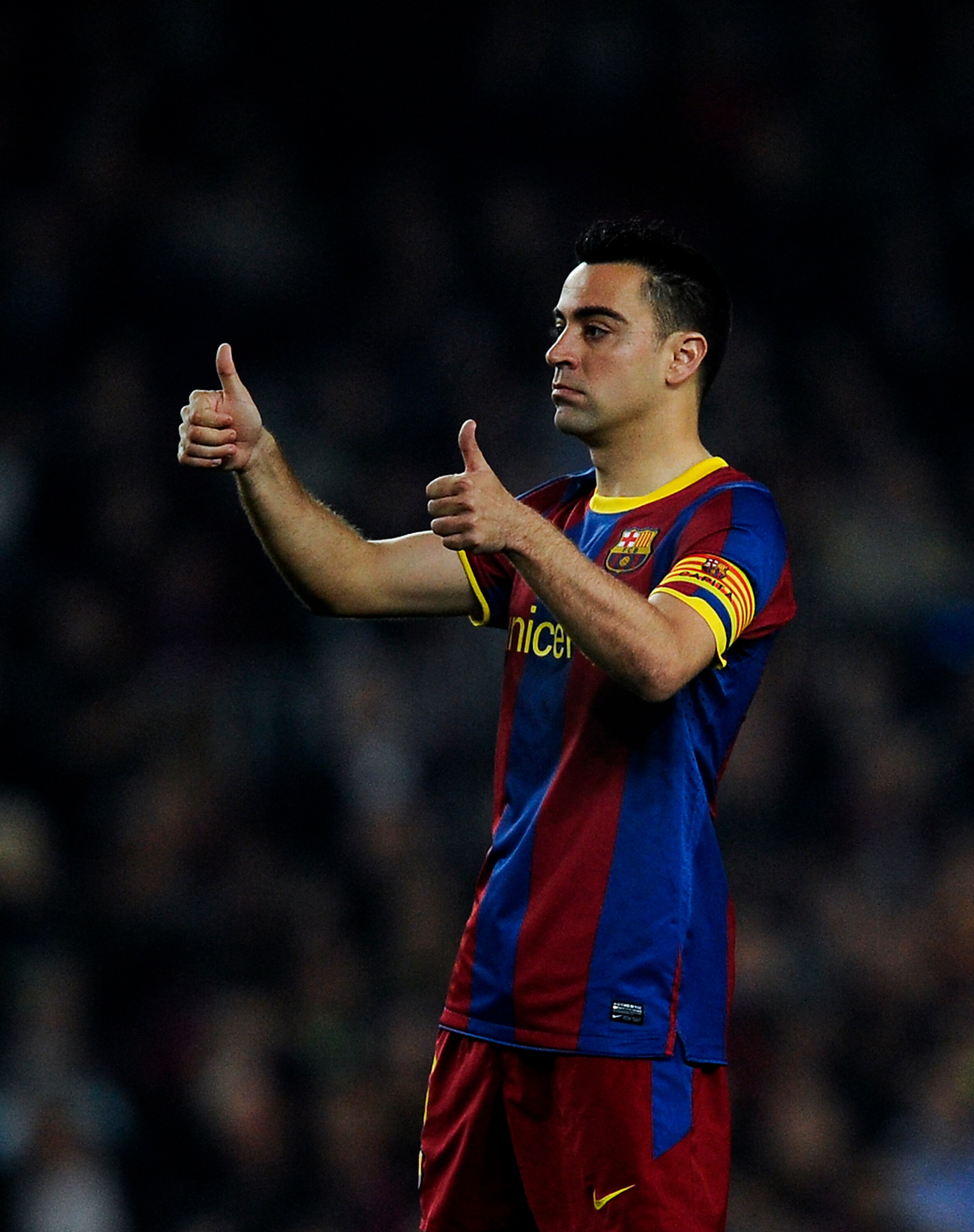 BARCELONA, SPAIN - APRIL 06:  Xavi Hernandez of FC Barcelona gives a thumbs up during the UEFA Champions League quarter final first leg match between Barcelona and Shakhtar Donetsk at the Camp Nou Stadium on April 6, 2011 in Barcelona, Spain.  (Photo by D