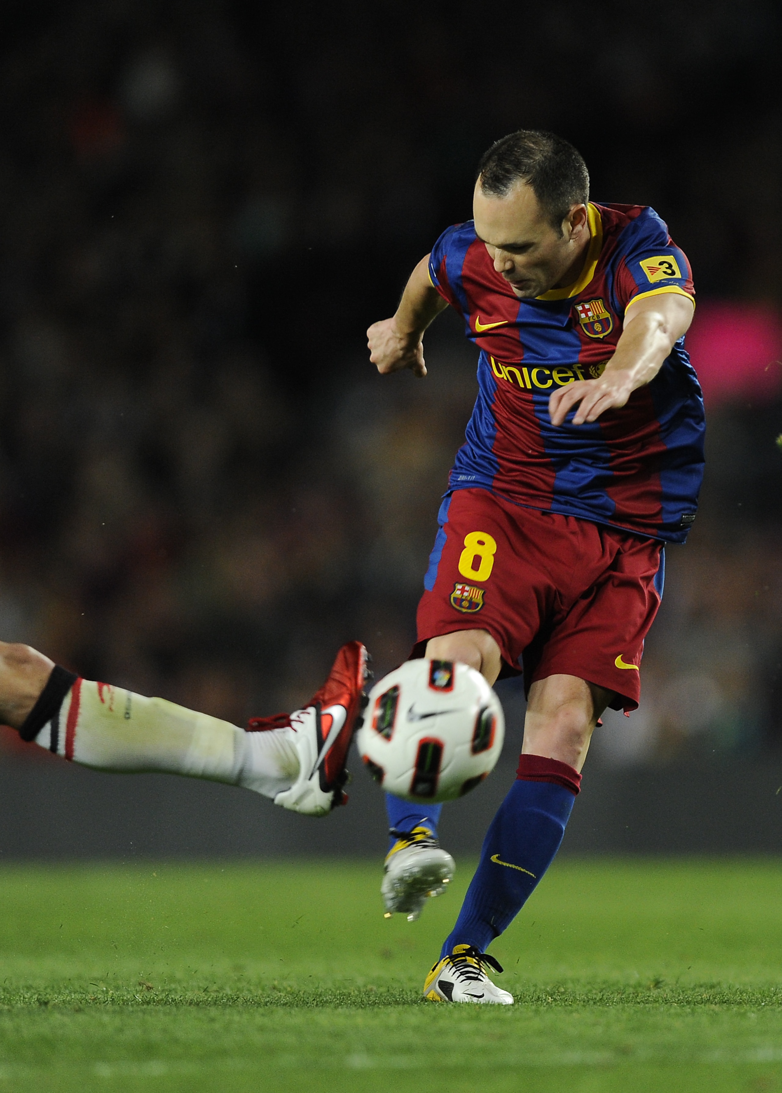 BARCELONA, SPAIN - APRIL 23: Andres Iniesta of FC Barcelona (C) shoots towards goal during the La Liga match between Barcelona and CA Osasuna at Camp Nou Stadium on April 23, 2011 in Barcelona, Spain. Barcelona won 2-0. (Photo by David Ramos/Getty Image BARCELONA, SPAIN - APRIL 23: Andres Iniesta of FC Barcelona (C) shoots towards goal during the La Liga match between Barcelona and CA Osasuna at Camp Nou Stadium on April 23, 2011 in Barcelona, Spain. Barcelona won 2-0. (Photo by David Ramos/Getty Image