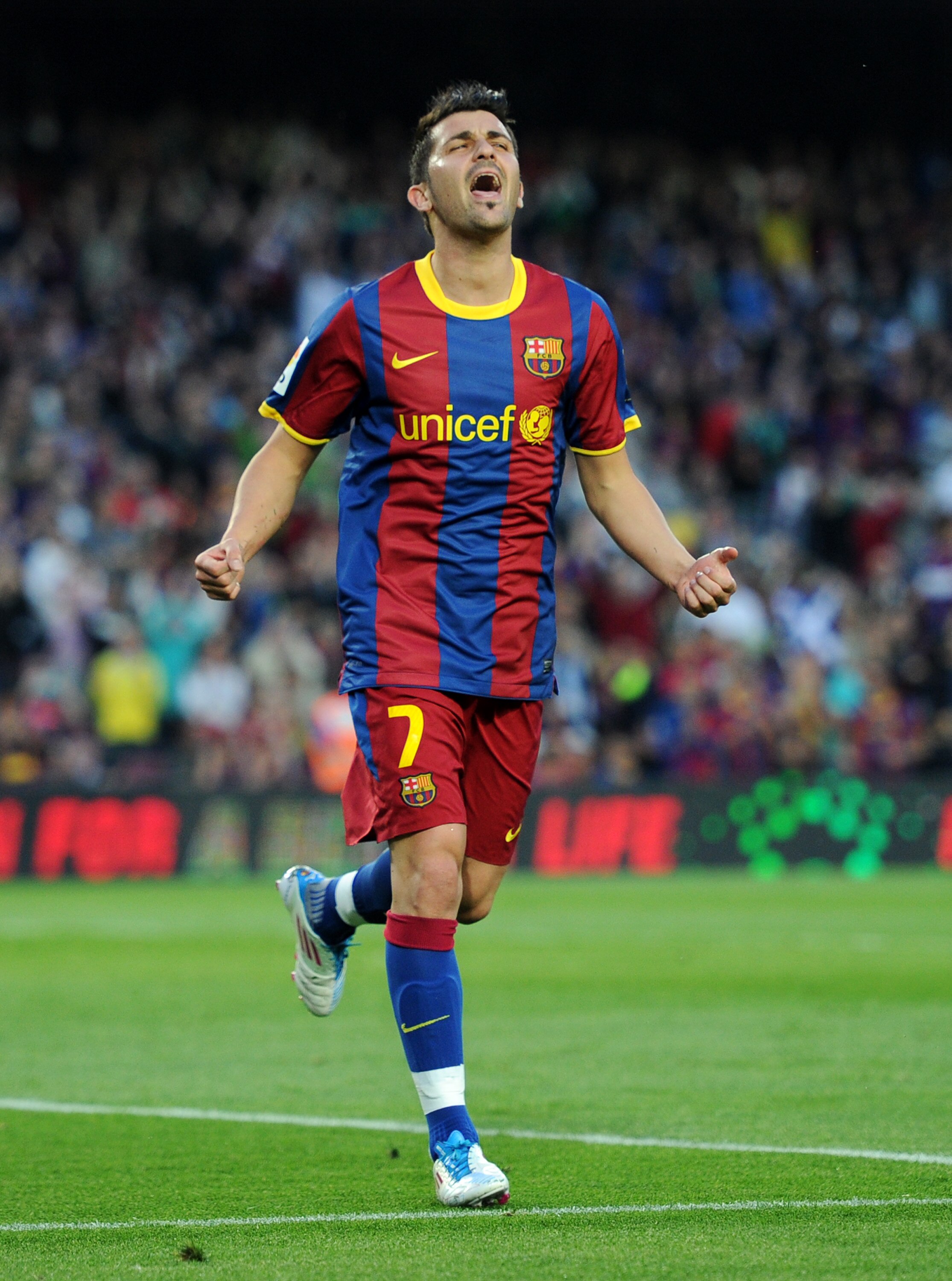 BARCELONA, SPAIN - APRIL 23:  David Villa of Barcelona celebrates scoring his sides opening goal during the la Liga match between Barcelona and Osasuna at the Camp Nou stadium on April 23, 2011 in Barcelona, Spain.  (Photo by Jasper Juinen/Getty Images)