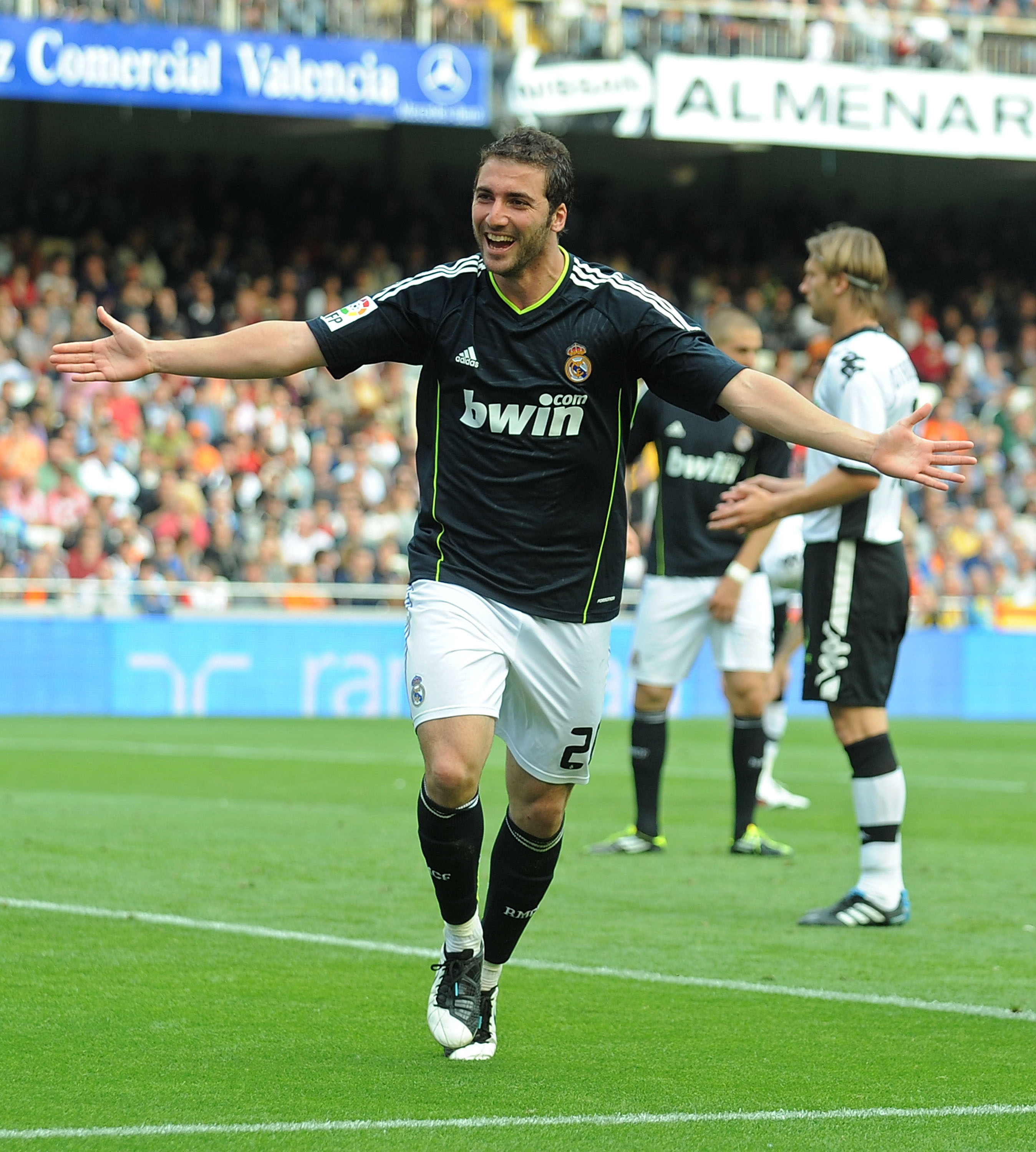 VALENCIA, SPAIN - APRIL 23: Gonzalo Higuain of Madrid celebrates after scoring his third goal against Valencia during the La Liga match between Valencia and Real Madrid at Estadio Mestalla on April 23, 2011 in Valencia, Spain.  (Photo by Denis Doyle/Getty