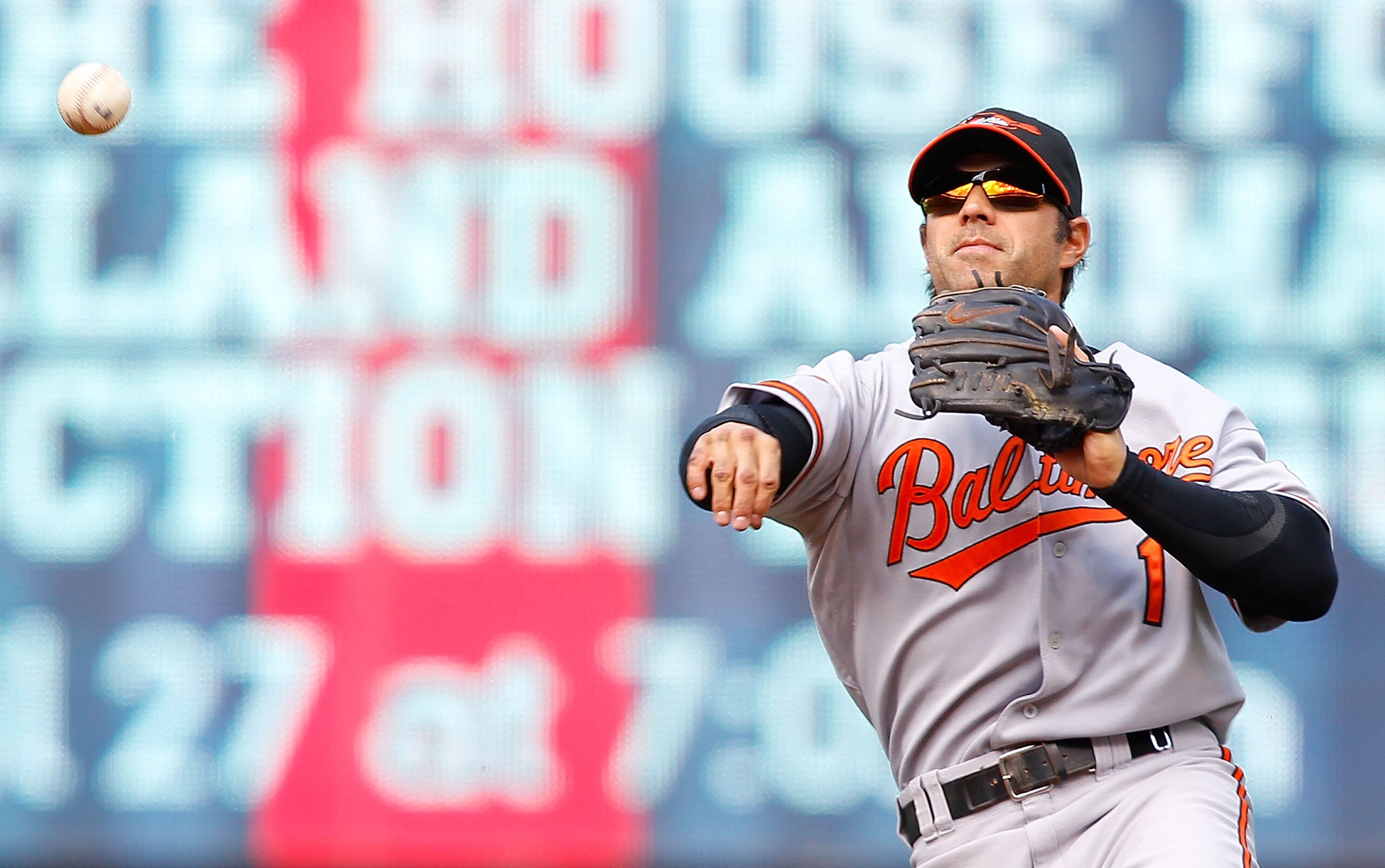 CLEVELAND - APRIL 17: Brian Roberts #1 of the Baltimore Orioles throws to first base during the game against the Cleveland Indians on April 17, 2011 at Progressive Field in Cleveland, Ohio.  (Photo by Jared Wickerham/Getty Images)