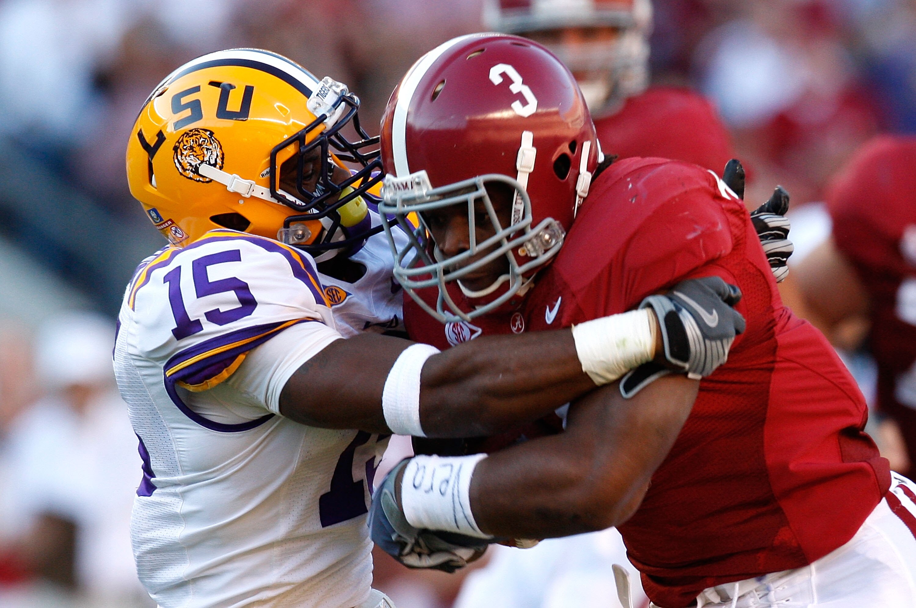 TUSCALOOSA, AL - NOVEMBER 07:  Trent Richardson #3 of the Alabama Crimson Tide rushes upfield against Brandon Taylor #15 of the Louisiana State University Tigers at Bryant-Denny Stadium on November 7, 2009 in Tuscaloosa, Alabama.  (Photo by Kevin C. Cox/G