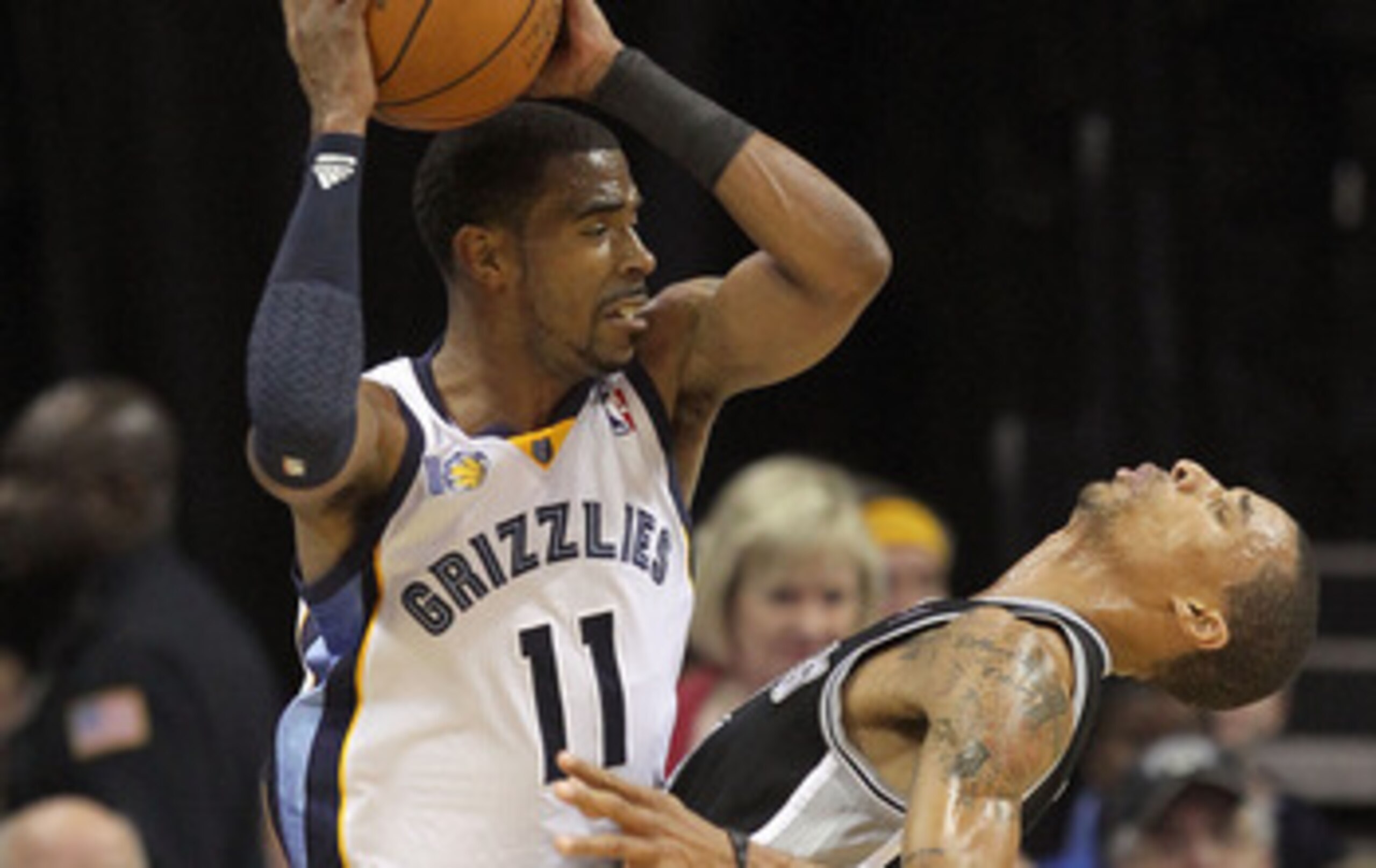 MEMPHIS, TN - APRIL 23:  23:  Mike Conley #11  of the  Memphis Grizziles is defended by George Hill #3 of the San Antonio Spurs in Game three of the Western Conference Quarterfinals in the 2011 NBA Playoffs at FedExForum on April 23, 2011 in Memphis, Tenn