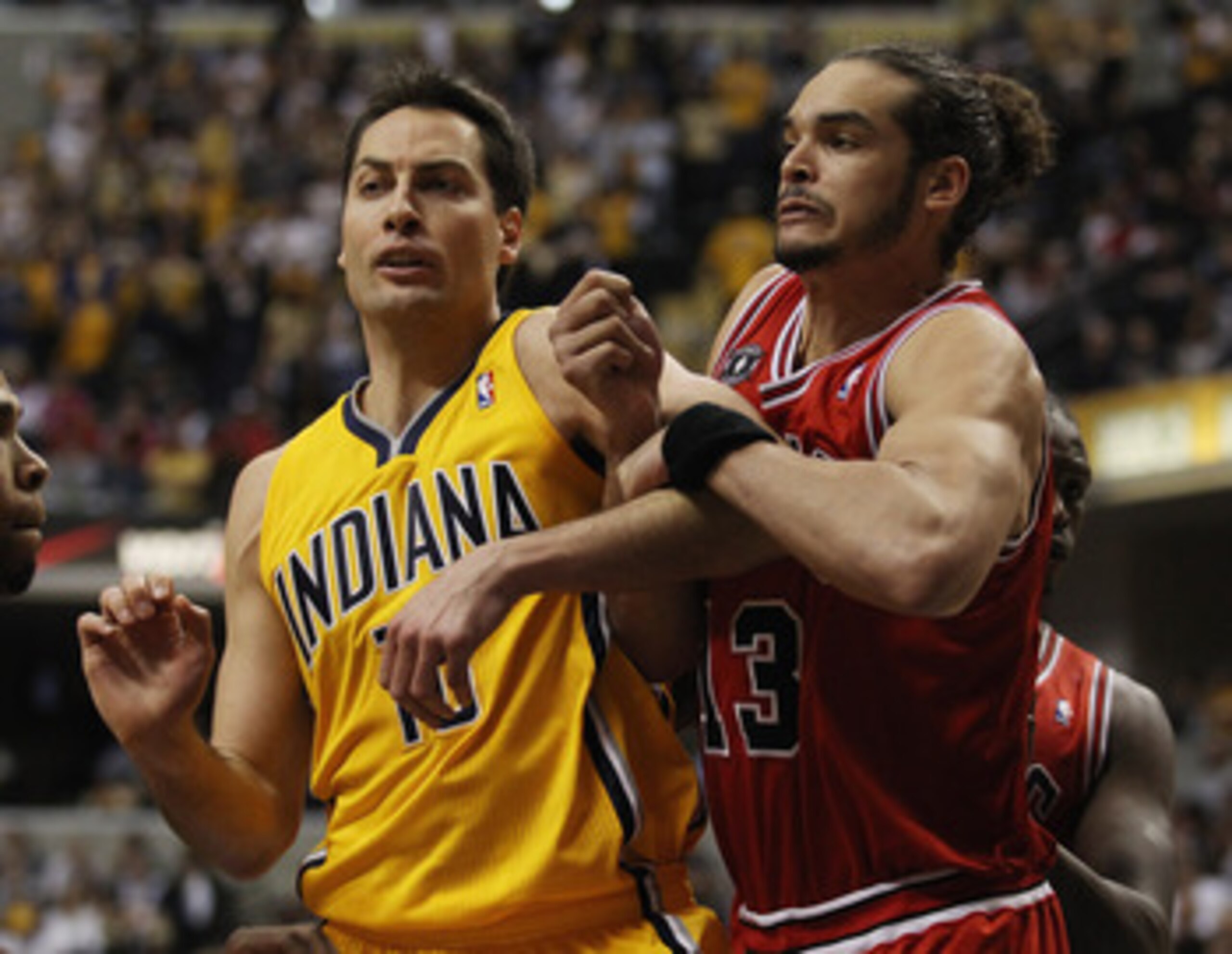 INDIANAPOLIS, IN - APRIL 23: Jeff Foster #10 of the Indiana Pacers and Joakim Noah #13 of the Chicago Bulls battle for position on a free-throw in Game Four of the Eastern Conference Quarterfinals in the 2011 NBA Playoffs at Conseco Fieldhouse on April 23