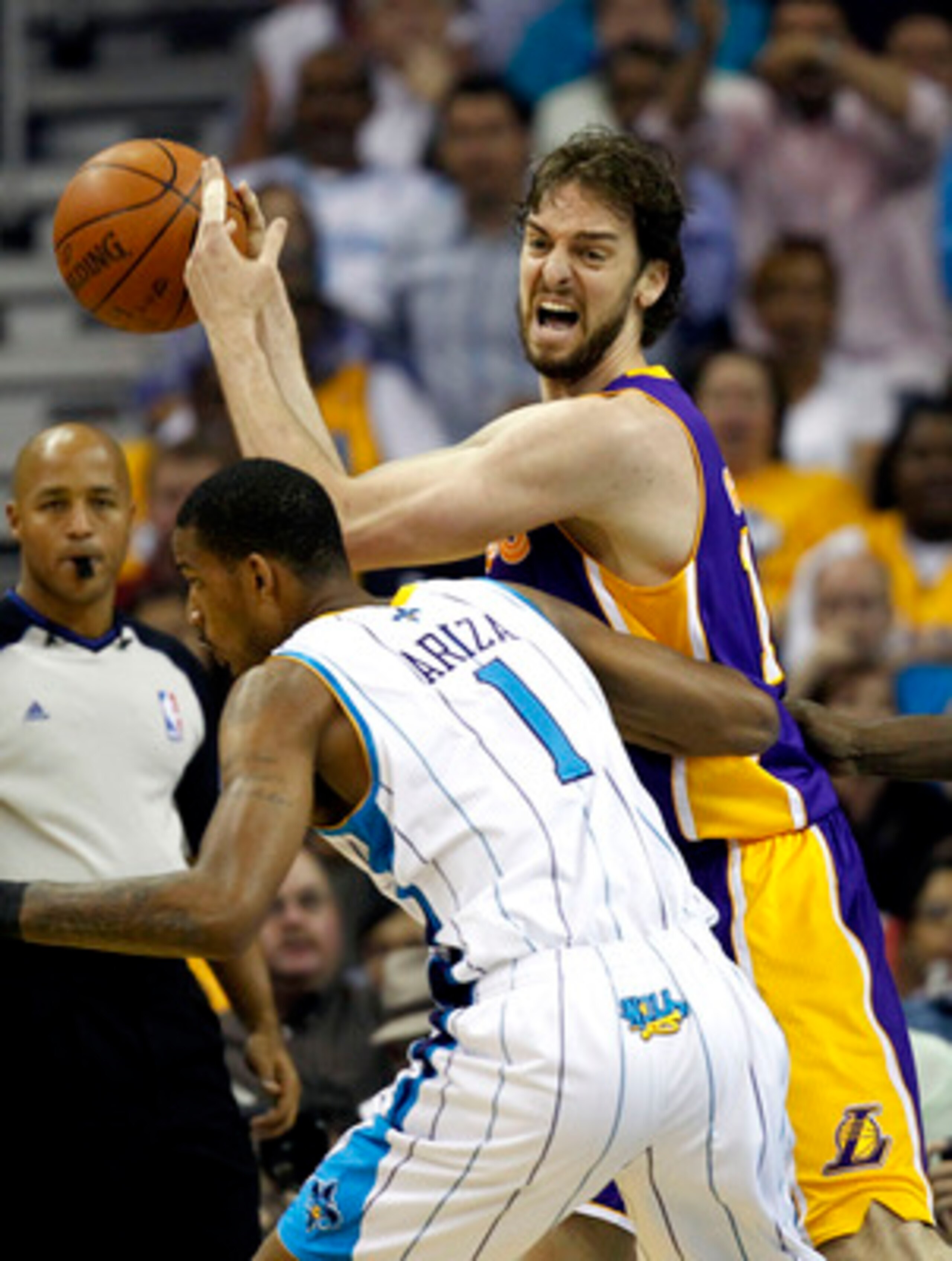 NEW ORLEANS - APRIL 24:  Trevor Ariza #1 of the New Orleans Hornets guards Pau Gasol #16 of the Los Angeles Lakers in Game Four of the Western Conference Quarterfinals in the 2011 NBA Playoffs at New Orleans Arena on April 24, 2011 in New Orleans, Louisia
