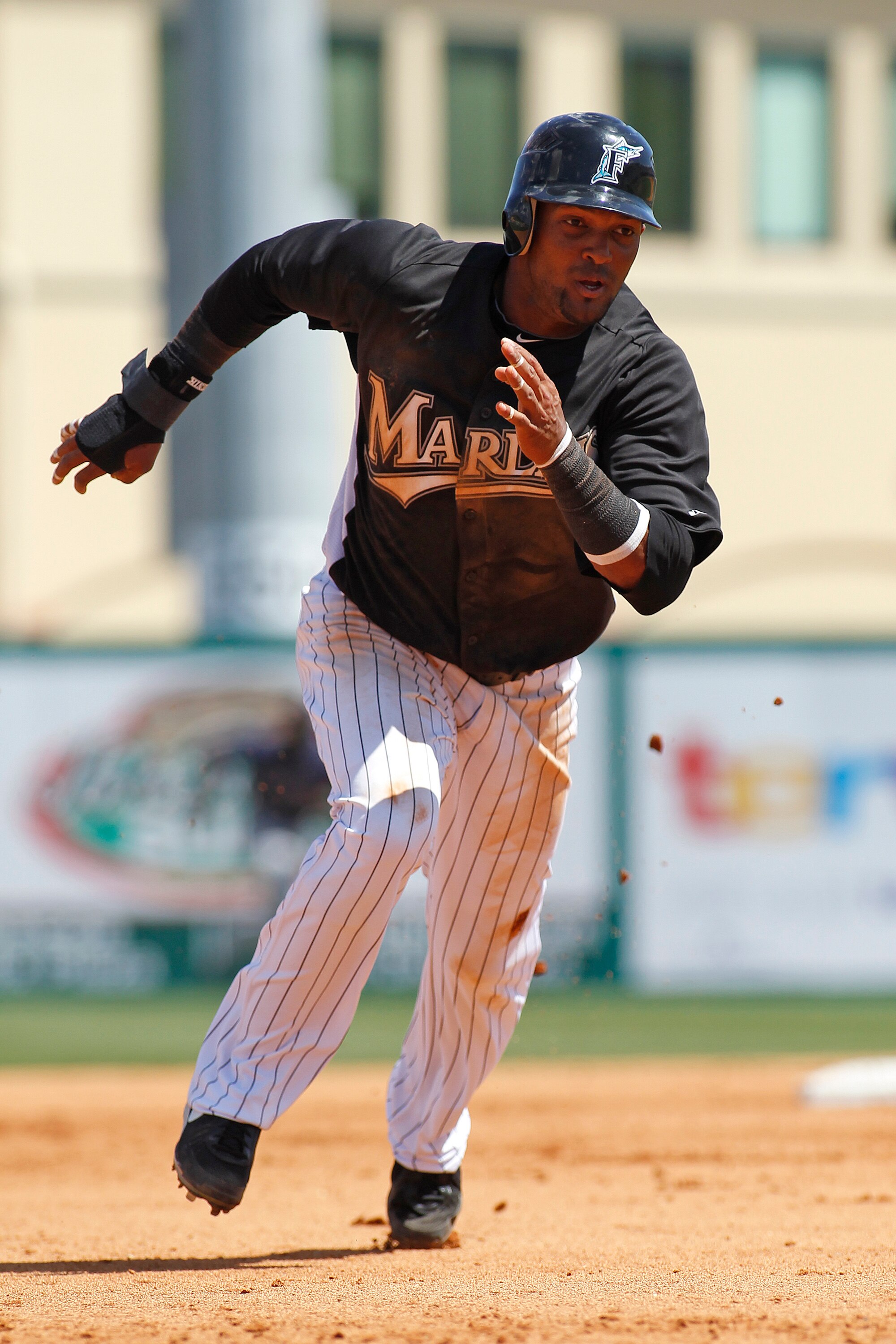 JUPITER, FL - MARCH 24: Emilio Bonifacio #1 of the Florida Marlins scores from second base against the Boston Red Sox at Roger Dean Stadium on March 24, 2011 in Jupiter, Florida. The Marlins defeated the Red Sox 15-7. (Photo by Joel Auerbach/Getty Images)