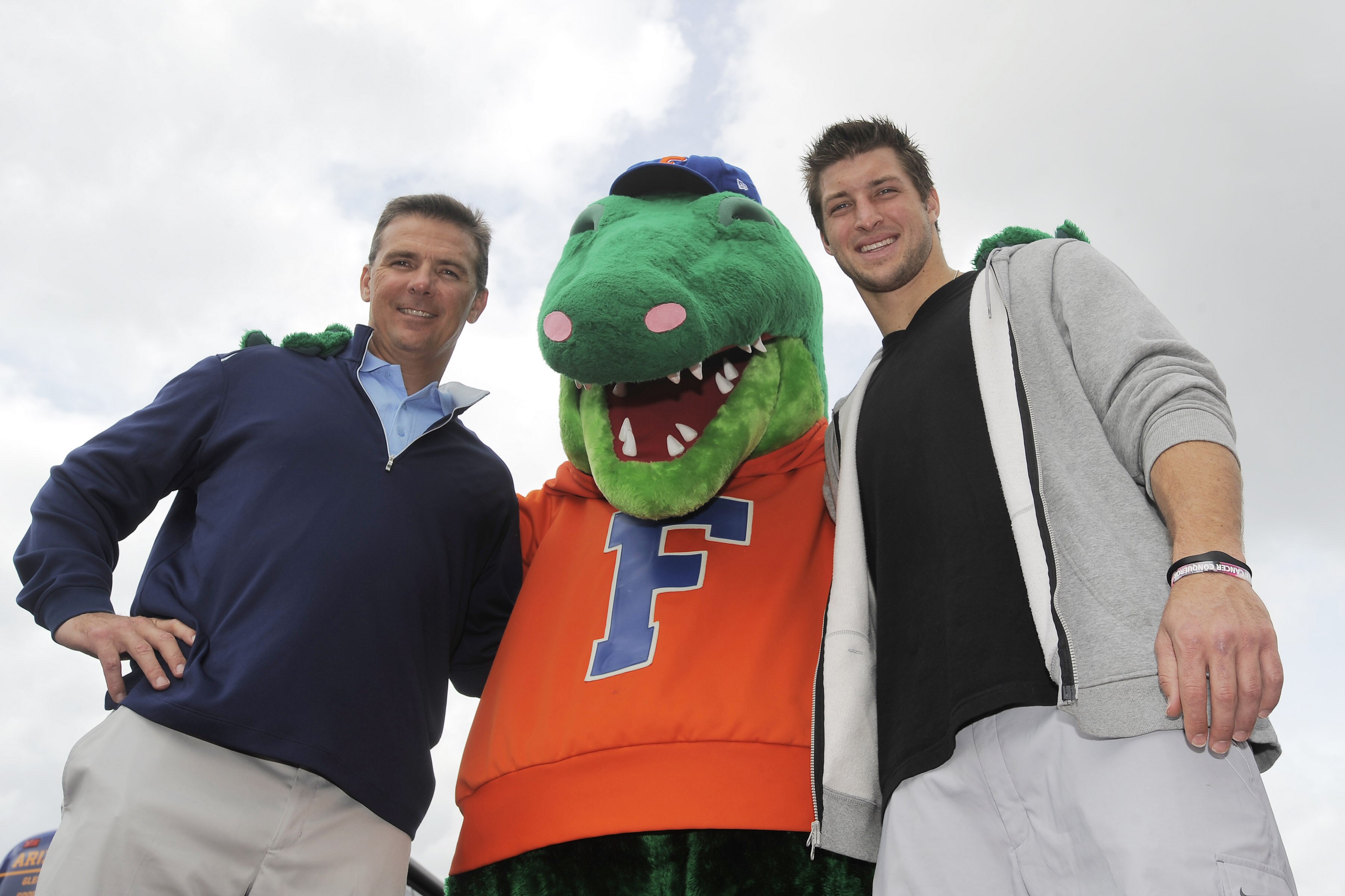 LAKE BUENA VISTA, FL - MARCH 05: (L-R) In this handout photo provided by Disney Parks, ESPN college football analyst and former University of Florida football coach, Urban Meyer, 'Albert' The University of Florida mascot and Denver Broncos Quarterback and