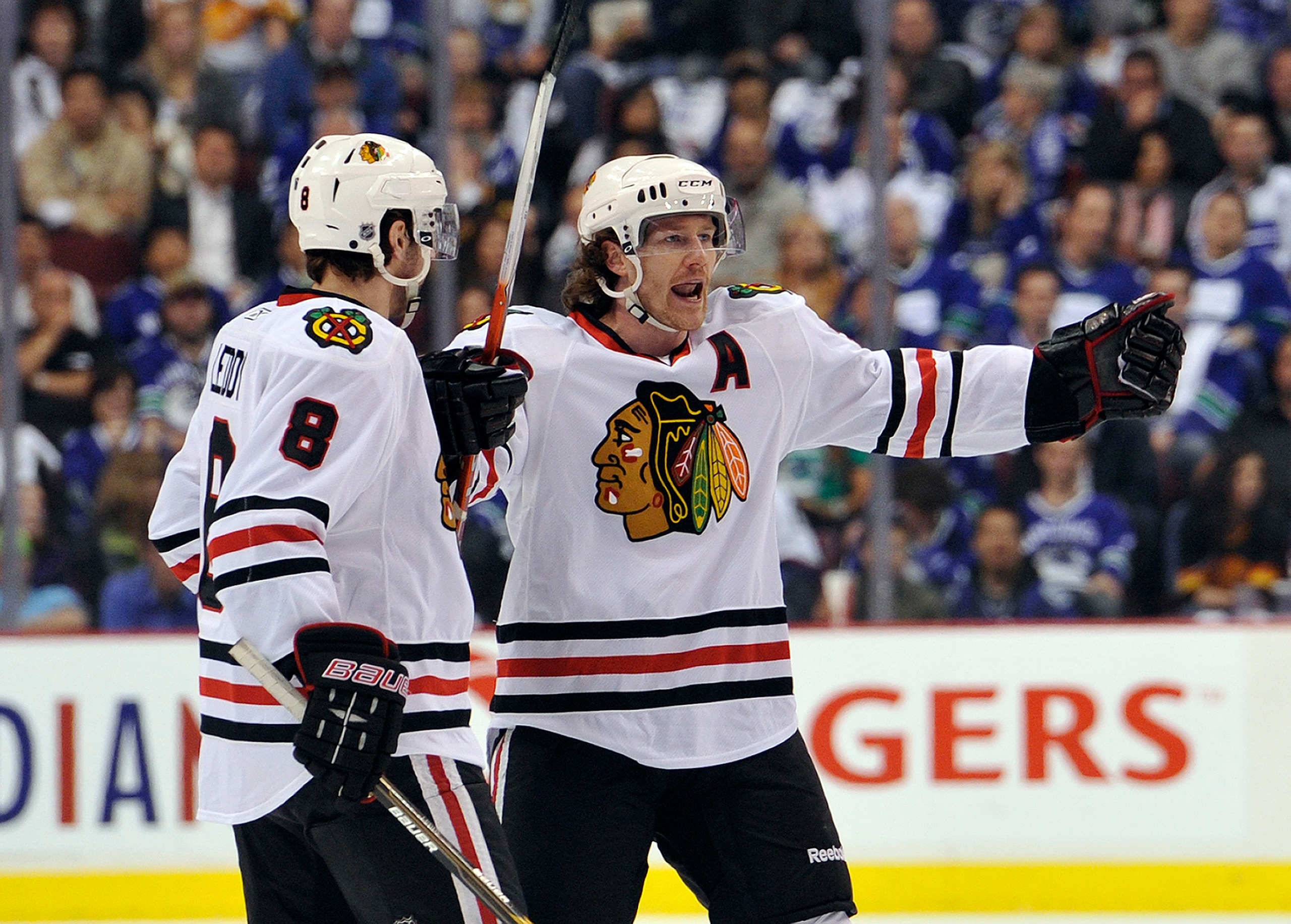 VANCOUVER, CANADA - APRIL 21: Nick Leddy #8  celebrates with Duncan Keith #2 of the Chicago Blackhawks after scoring a goal during the first period in Game Five of the Western Conference Quarterfinals during the 2011 NHL Stanley Cup Playoffs   on April 21