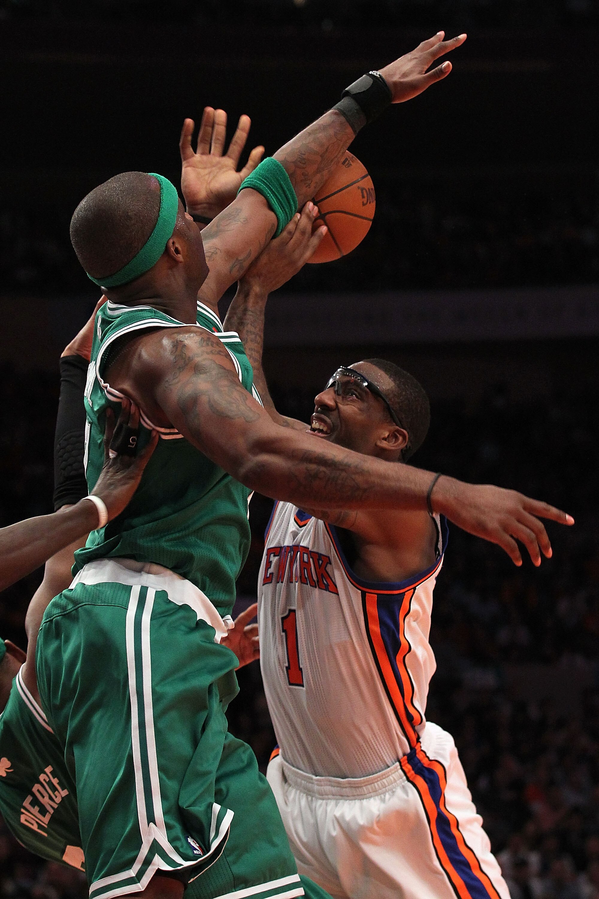 NEW YORK, NY - APRIL 22:  Amar'e Stoudemire #1 of the New York Knicks loses the ball as he drives against Jermaine O'Neal #7 of the Boston Celtics in Game Three of the Eastern Conference Quarterfinals in the 2011 NBA Playoffs on April 22, 2011 at Madison