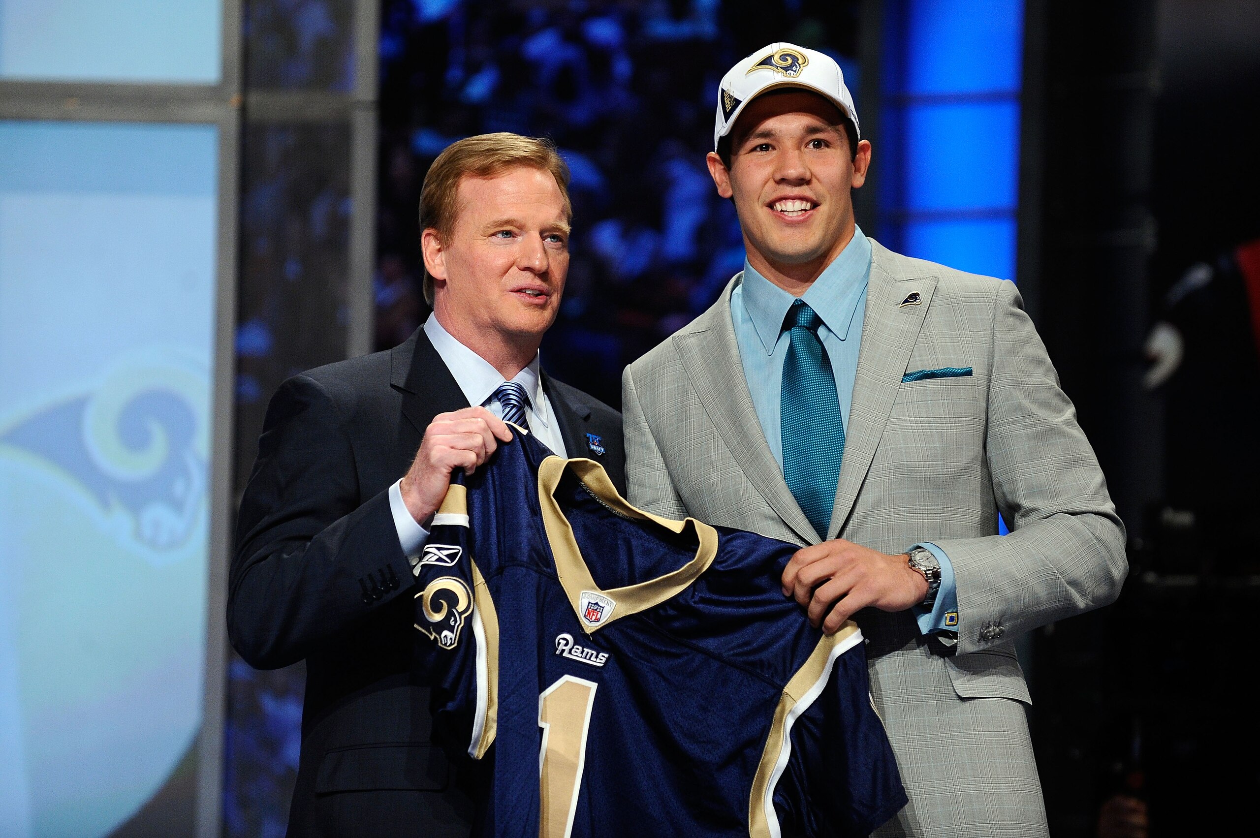 NEW YORK - APRIL 22:  Quarterback Sam Bradford of the Oklahoma Sooners holds up a St. Louis Rams jersey as he stands with NFL Commissioner Roger Goodell after Bradford was picked numer 1 overall by the Rams during the 2010 NFL Draft at Radio City Music Ha