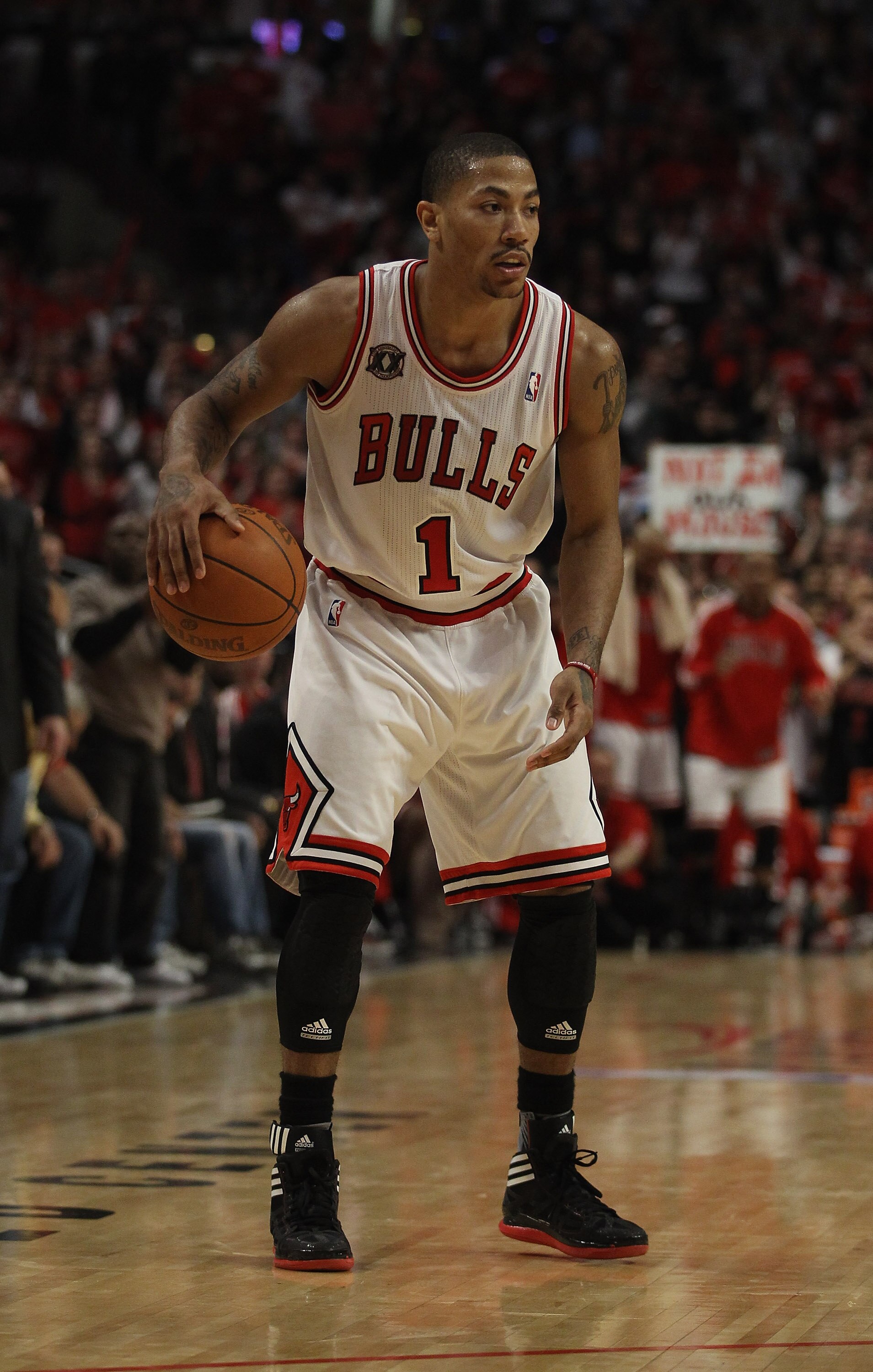 CHICAGO, IL - APRIL 18: Derrick Rose #1 of the Chicago Bulls looks over the Indiana Pacer defense in Game Two of the Eastern Conference Quarterfinals in the 2011 NBA Playoffs at the United Center on April 18, 2011 in Chicago, Illinois. The Bulls defeated