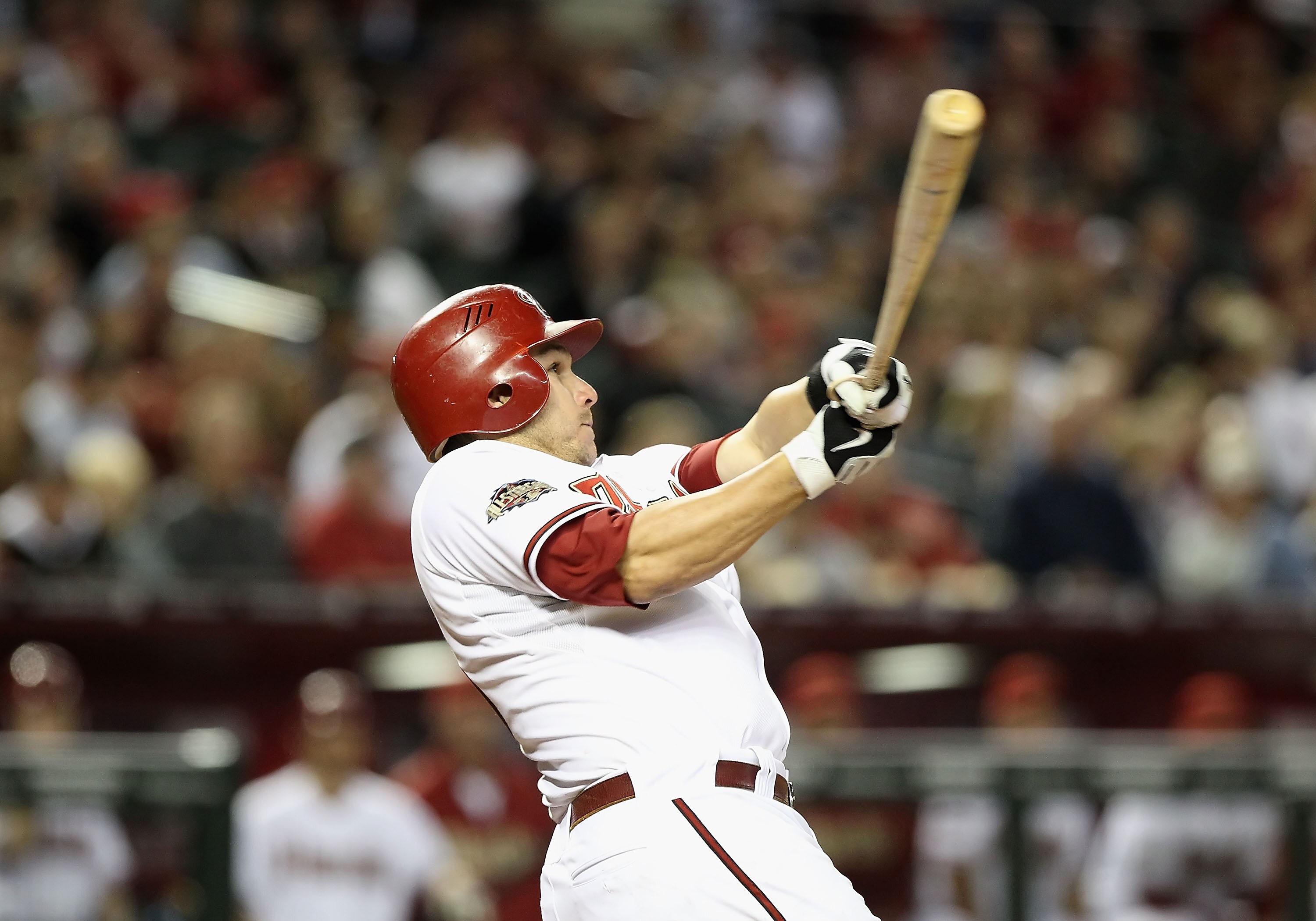 PHOENIX, AZ - APRIL 08:  Miguel Montero #26 of the Arizona Diamondbacks bats against the Cincinnati Reds during the Major League Baseball home opening game at Chase Field on April 8, 2011 in Phoenix, Arizona. The Diamondbacks defeated the Reds 13-2.  (Pho