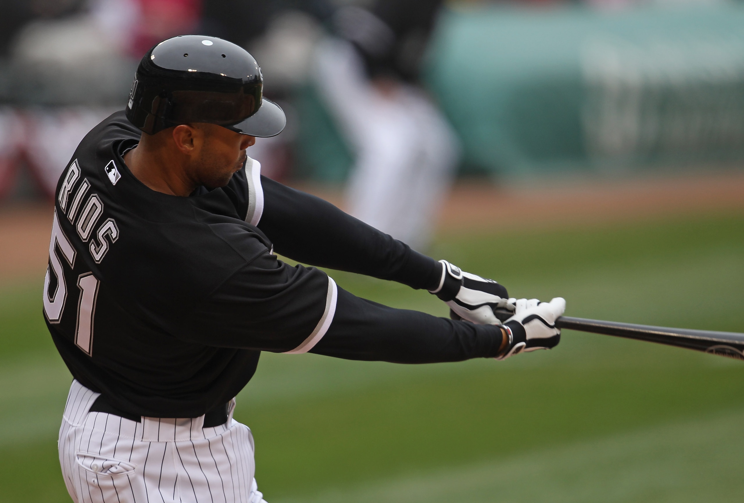 CHICAGO, IL - APRIL 07: Alex Rios #51 of the Chicago White Sox hits his second double of the day against the Tampa Bay Rays during the home opener at U.S. Cellular Field on April 7, 2011 in Chicago, Illinois. (Photo by Jonathan Daniel/Getty Images)