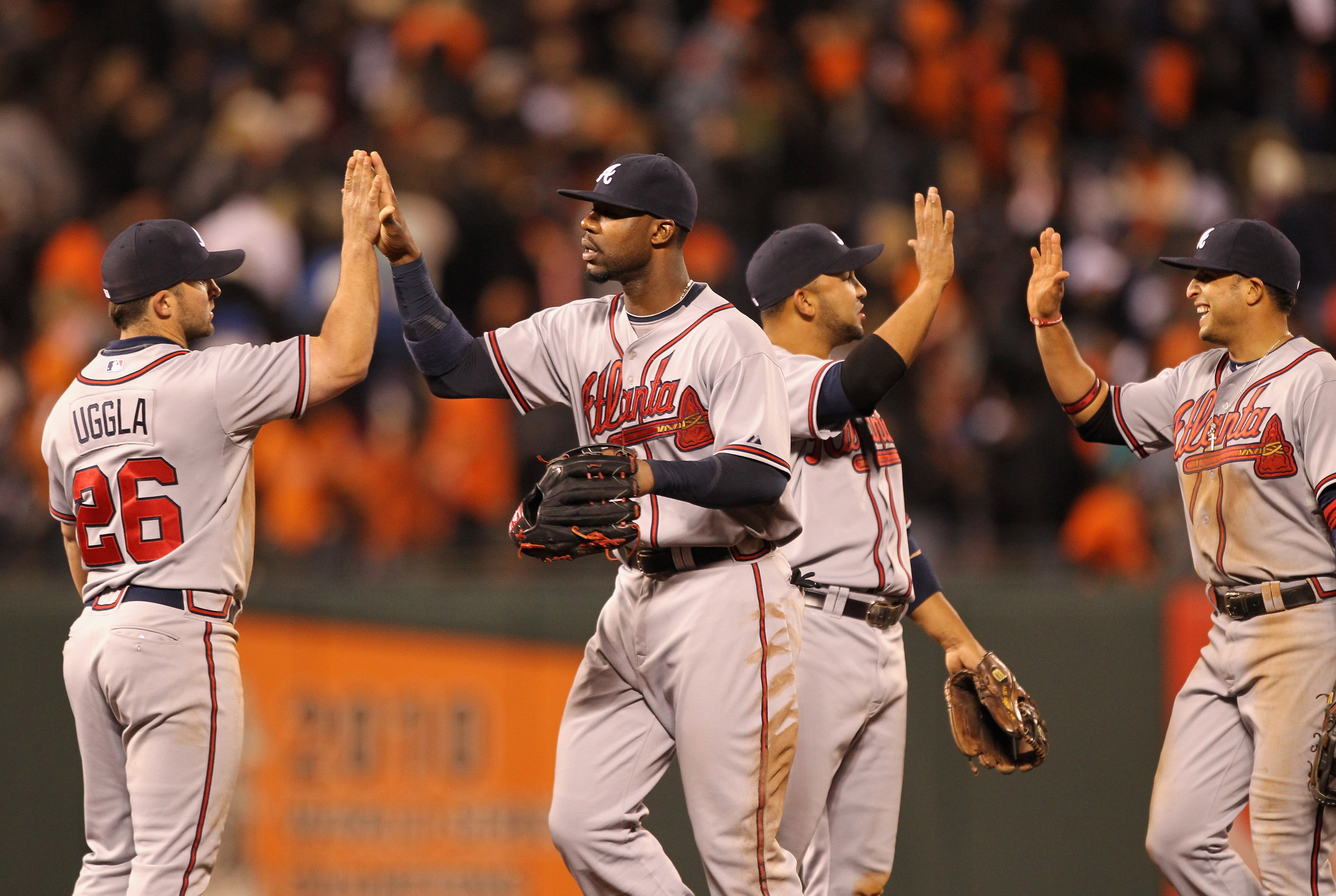 SAN FRANCISCO, CA - APRIL 22:  Jason Heyward #22 and Dan Uggla #26 of the Atlanta Braves celebrate after they beat the San Francisco Giants at AT&T Park on April 22, 2011 in San Francisco, California.  (Photo by Ezra Shaw/Getty Images)