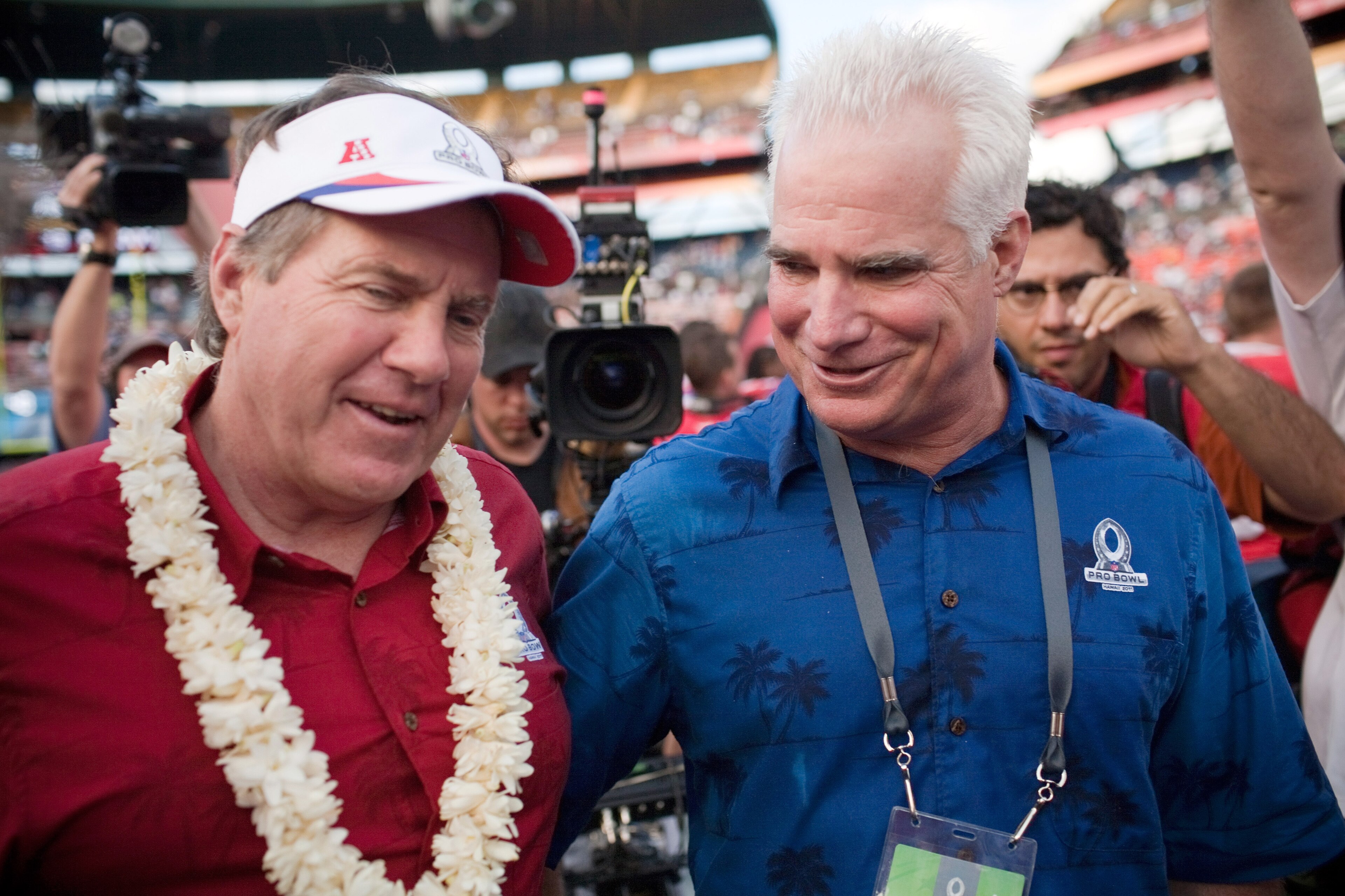 HONOLULU - JANUARY 30:  Bill Belichick (L) Head Coach of the American Football Conference team, and Michael Smith, Head Coach of the National Football Conference team greet each other at the end of the 2011 NFL Pro Bowl at Aloha Stadium on January 30, 201