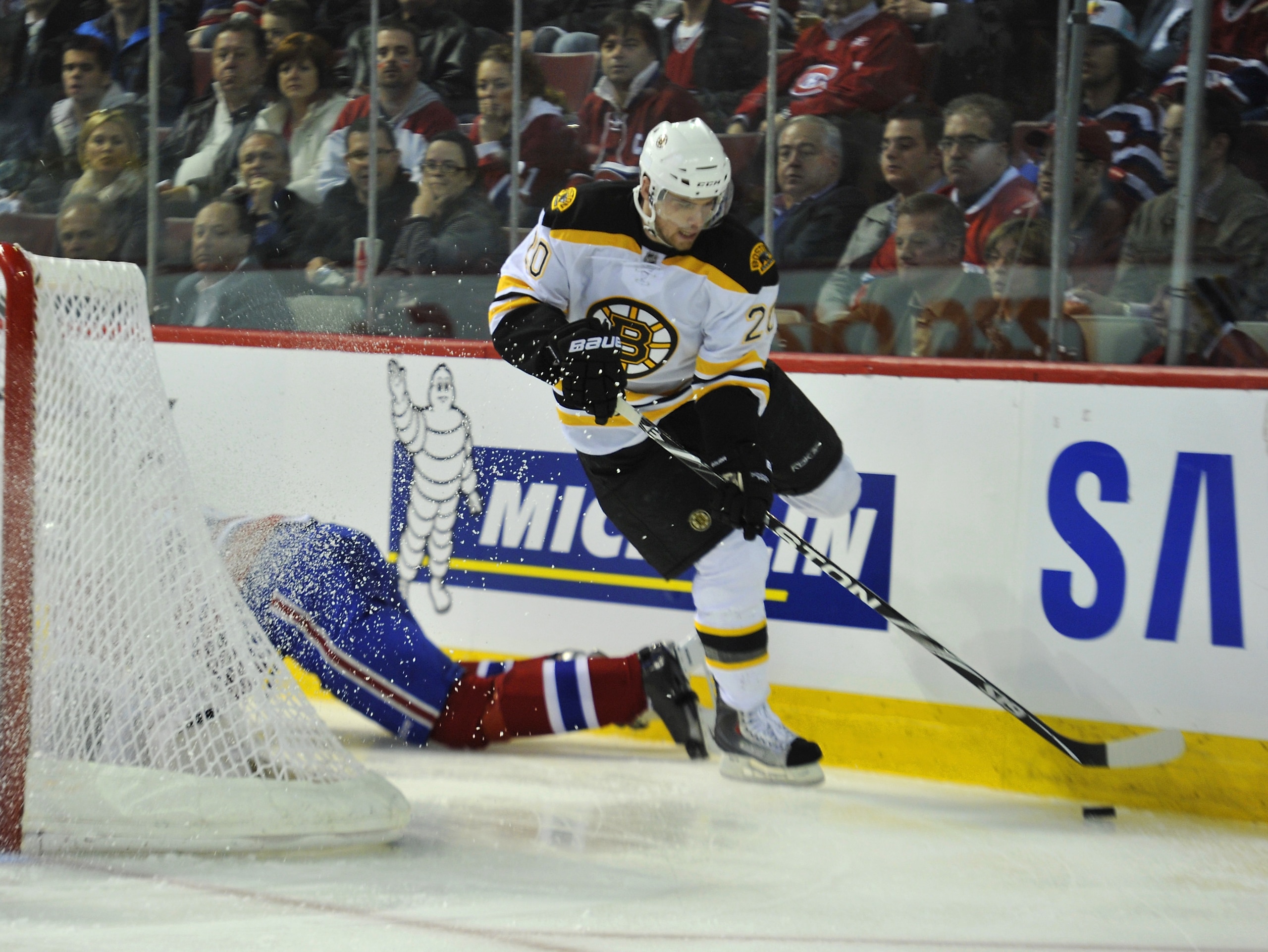 MONTREAL, CANADA - APRIL 18: Daniel Paille #20 of the Boston Bruins jumps past a sprawling Montreal Canadiens players in Game Three of the Eastern Conference Quarterfinals during the 2011 NHL Stanley Cup Playoffs at the Bell Centre on April 18, 2011 in M MONTREAL, CANADA - APRIL 18: Daniel Paille #20 of the Boston Bruins jumps past a sprawling Montreal Canadiens players in Game Three of the Eastern Conference Quarterfinals during the 2011 NHL Stanley Cup Playoffs at the Bell Centre on April 18, 2011 in M