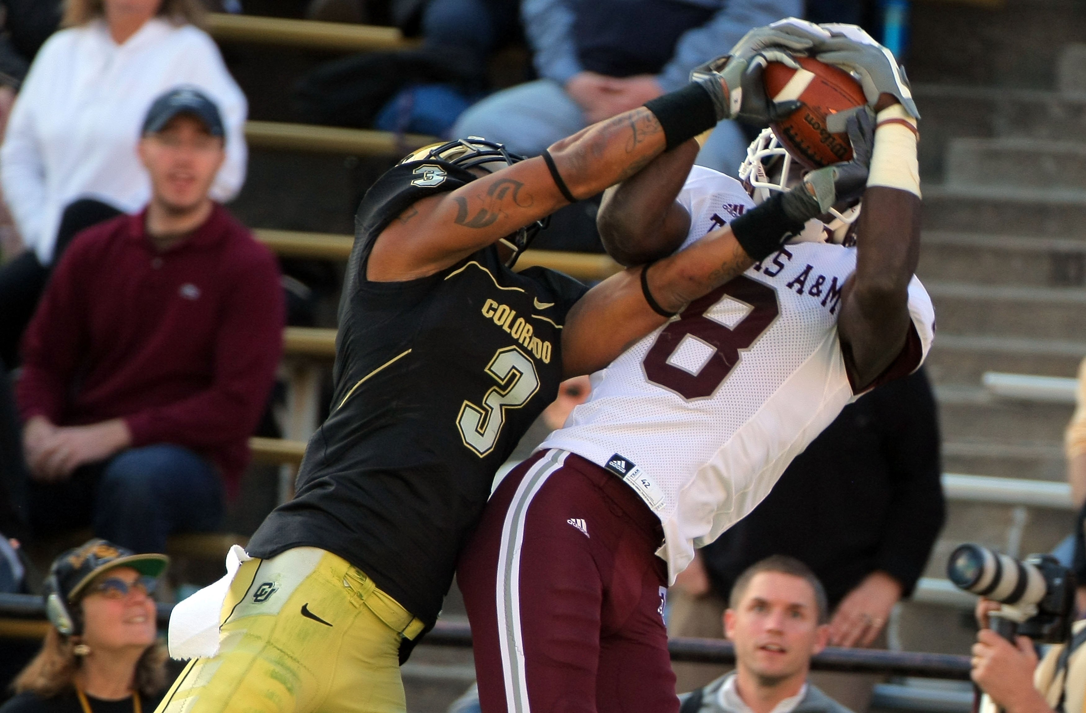 BOULDER, CO - NOVEMBER 07:  Wide receiver Jeff Fuller #8 of the Texas A&M Aggies makes a reception against the defense of Jimmy Smith #3 of the Colorado Buffaloes during NCAA college football action at Folsom Field on November 7, 2009 in Boulder, Colorado
