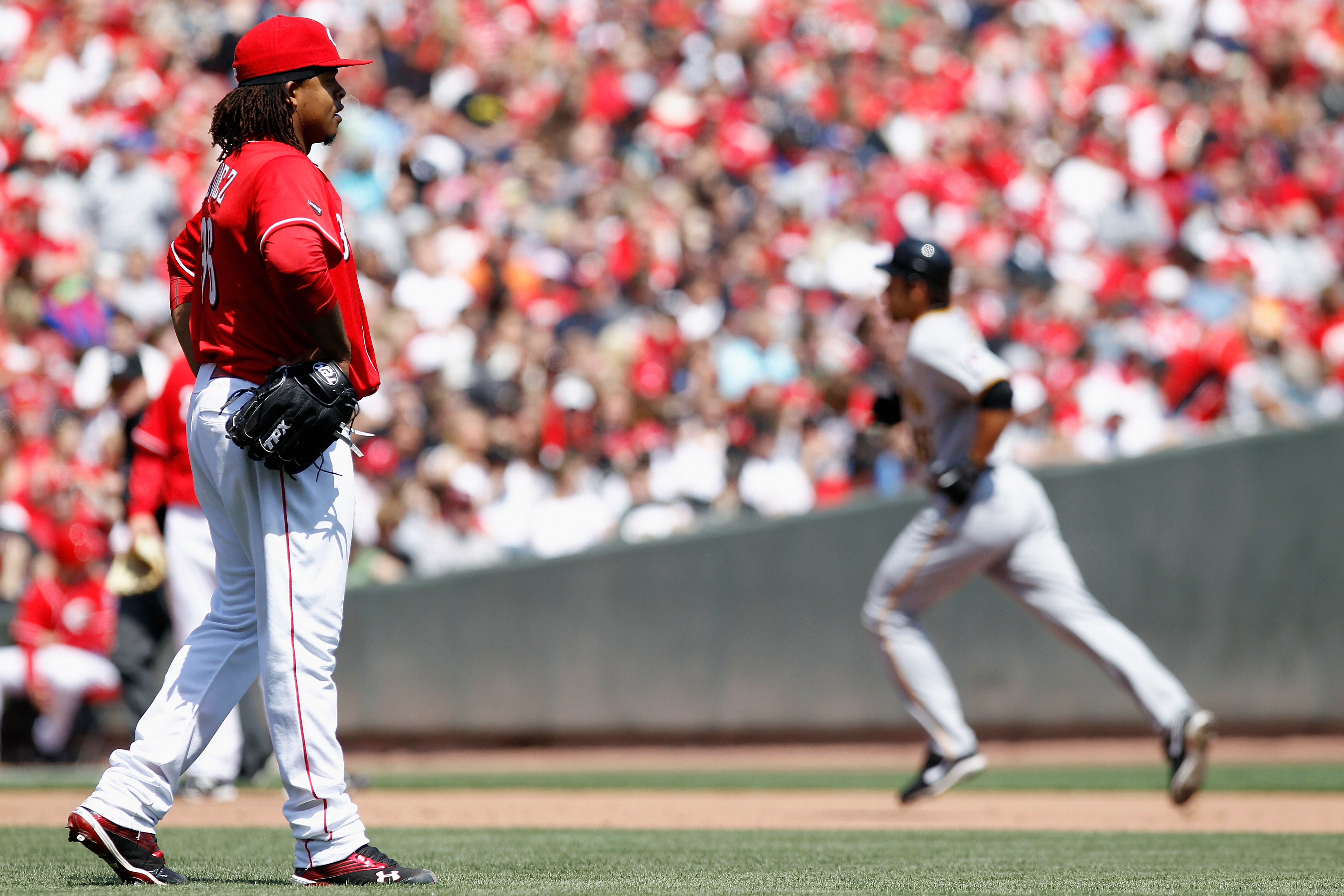CINCINNATI, OH - APRIL 17: Edinson Volquez #36 of the Cincinnati Reds reacts after giving up a solo home run in the sixth inning to Garrett Jones #46 of the Pittsburgh Pirates at Great American Ball Park on April 17, 2011 in Cincinnati, Ohio. The Pirates 