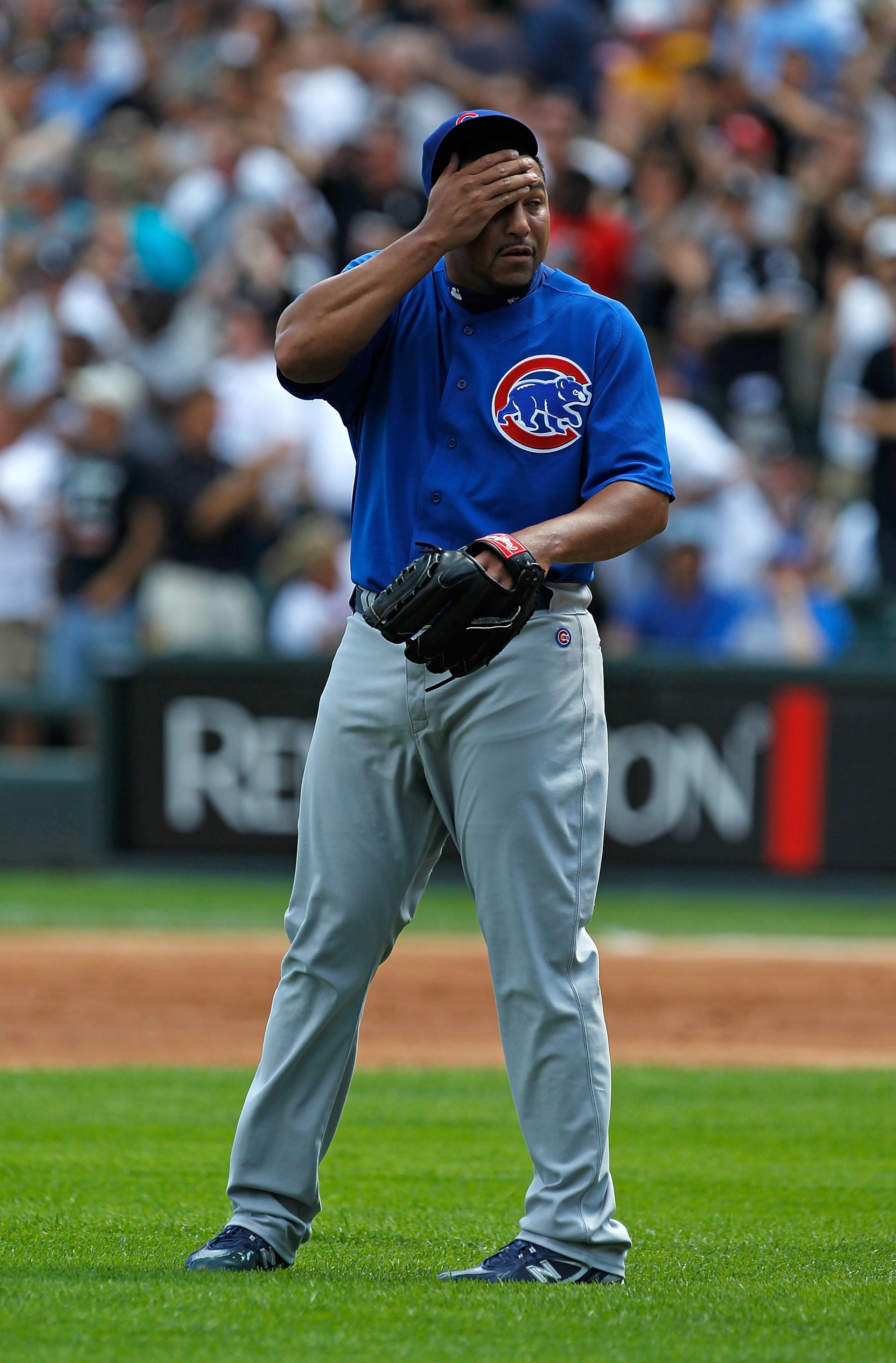 CHICAGO - JUNE 25: Starting pitcher Carlos Zambrano #38 of the Chicago Cubs reacts after giving up a three-run home run in the 1st inning to Carlos Quentin of the Chicago White Sox at U.S. Cellular Field on June 25, 2010 in Chicago, Illinois. Zambrano wa CHICAGO - JUNE 25: Starting pitcher Carlos Zambrano #38 of the Chicago Cubs reacts after giving up a three-run home run in the 1st inning to Carlos Quentin of the Chicago White Sox at U.S. Cellular Field on June 25, 2010 in Chicago, Illinois. Zambrano wa
