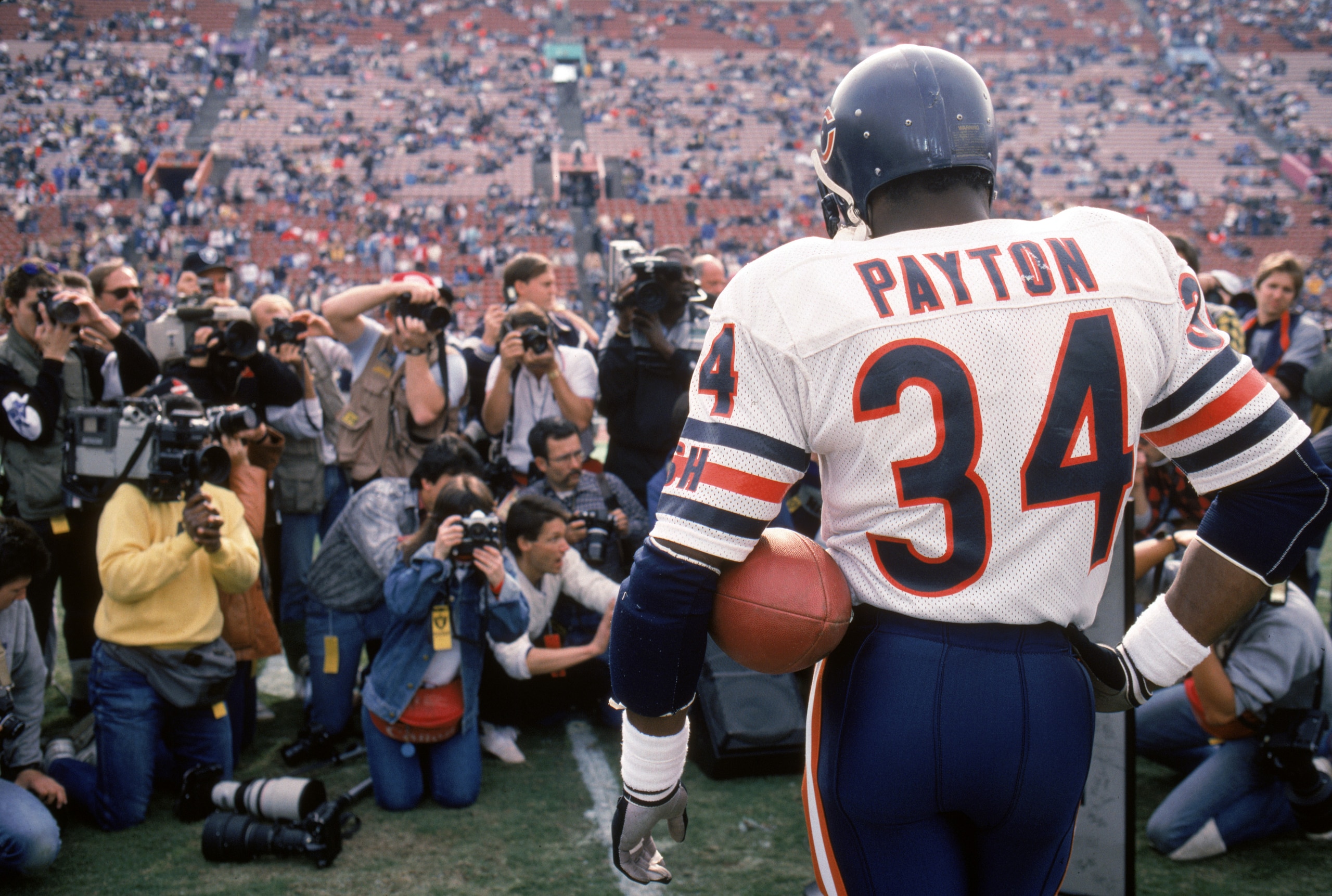 LOS ANGELES - DECEMBER 27:  Running back Walter Payton #34 of the Chicago Bears is honored during pre-game ceremonies in his last regular season game on December 27, 1987 against the Los Angeles Raiders at the Los Angeles Memorial Coliseum in Los Angeles,